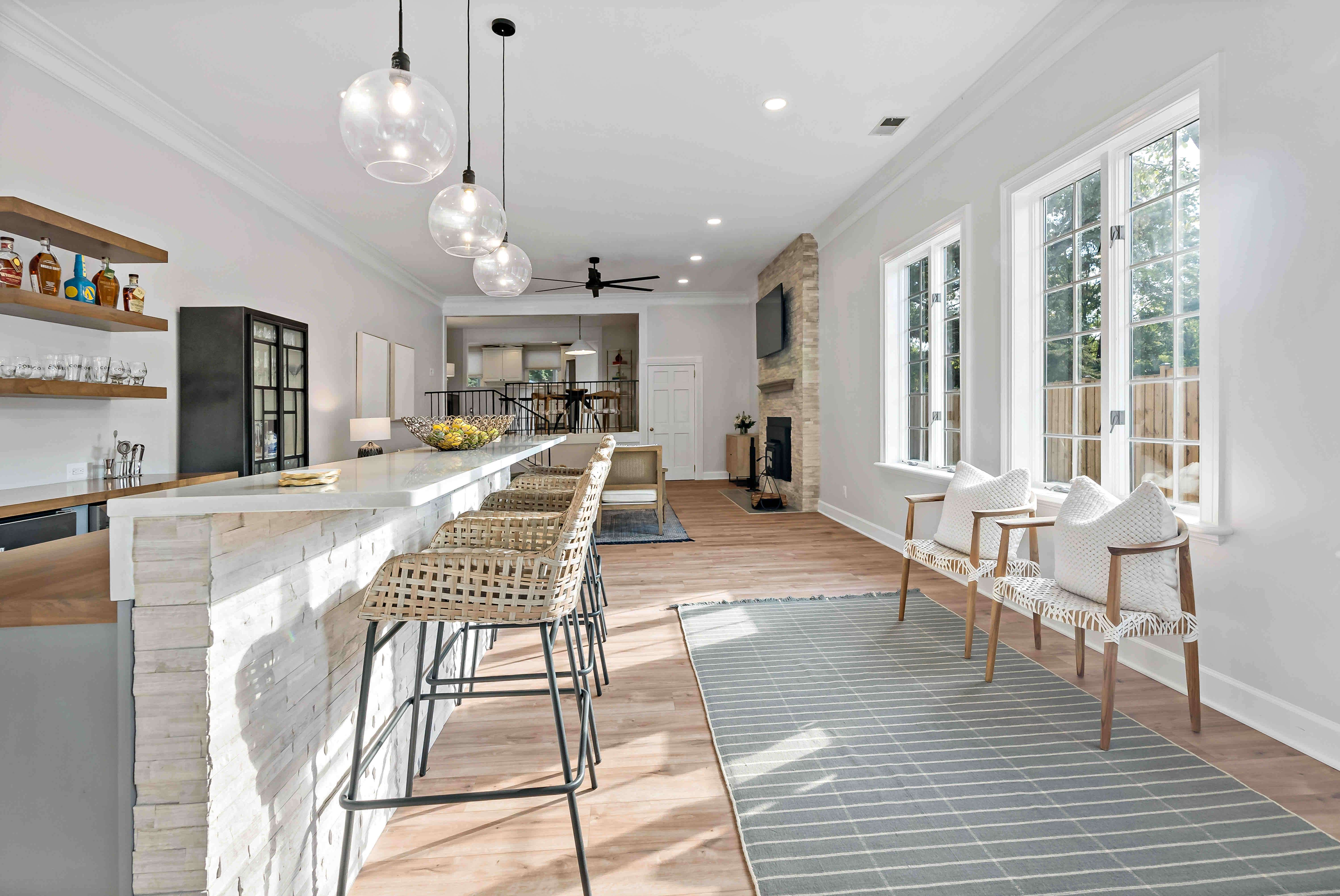 Open bar area with seating in Annandale home