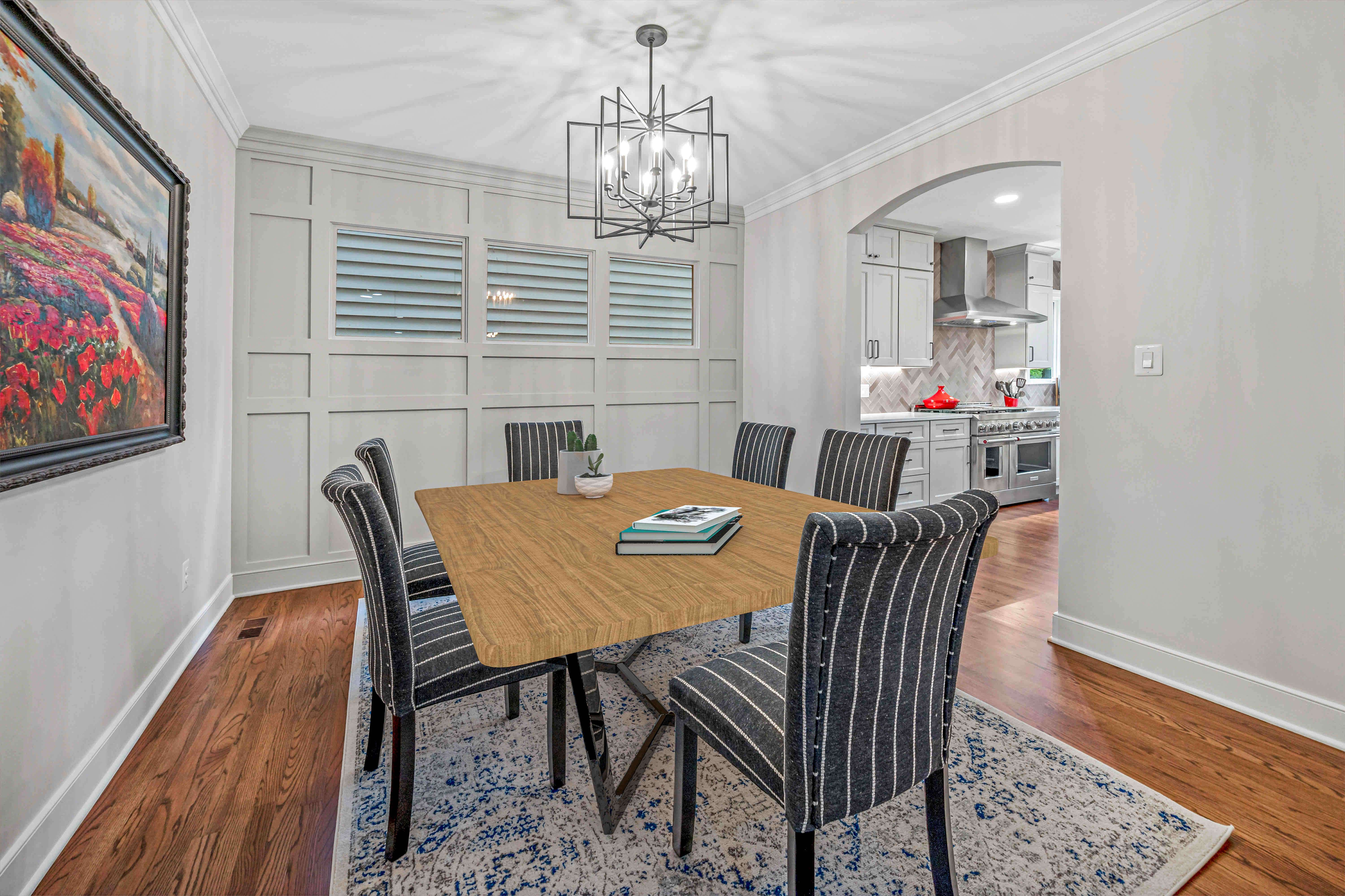 Hard wood floors and white walls in dining room