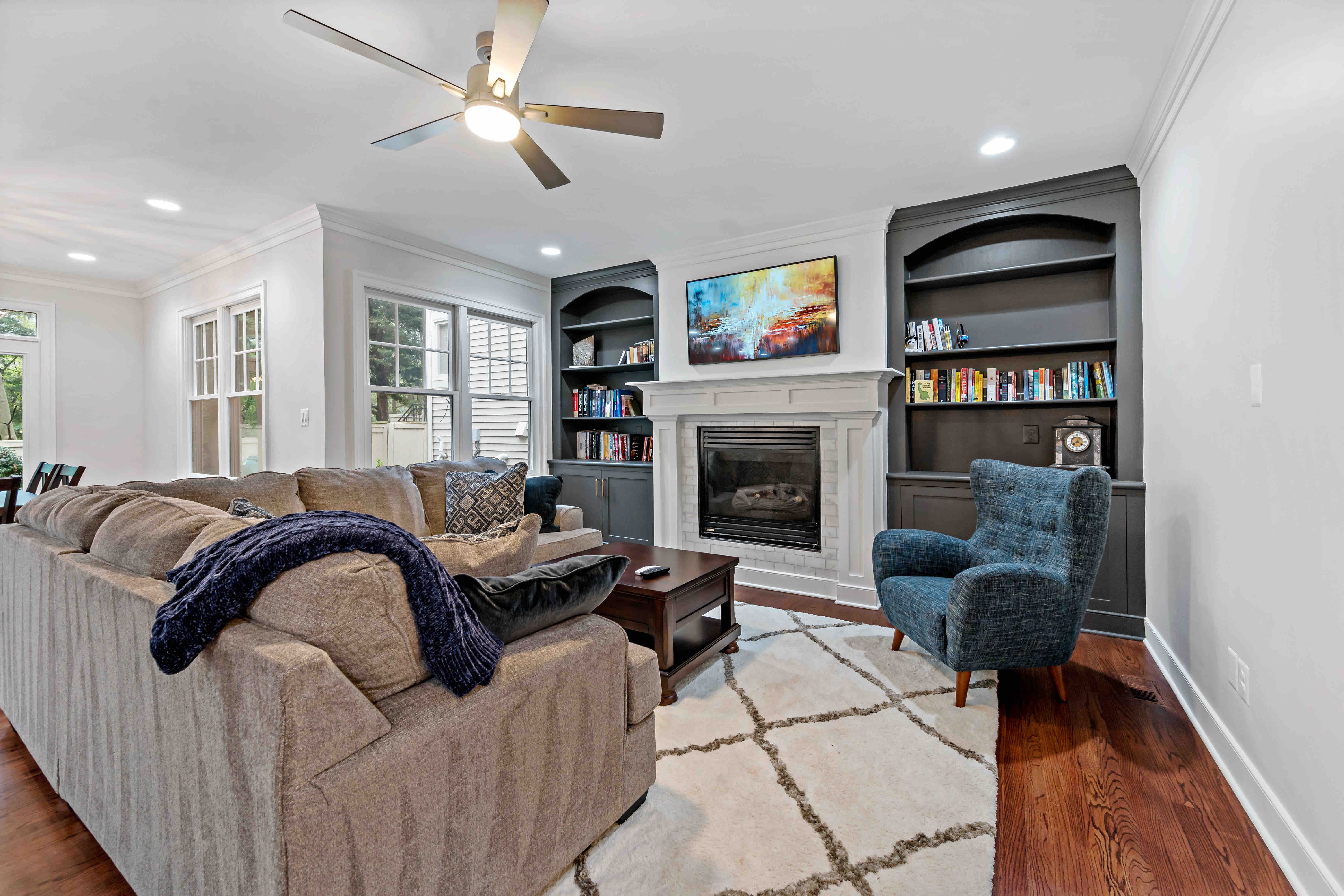 Living room with fireplace and built-in shelves