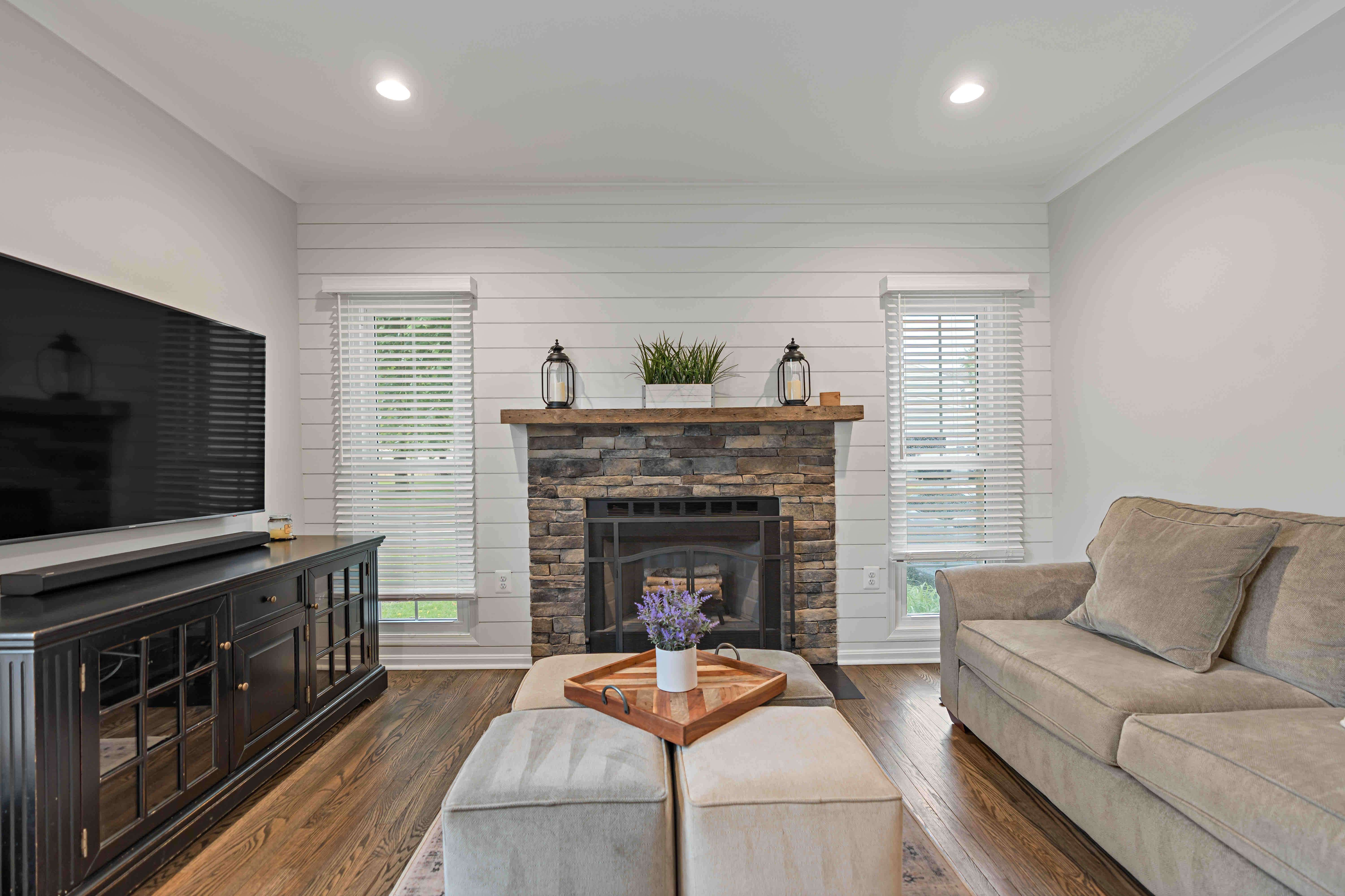 Brown stone and brick fireplace with mantle