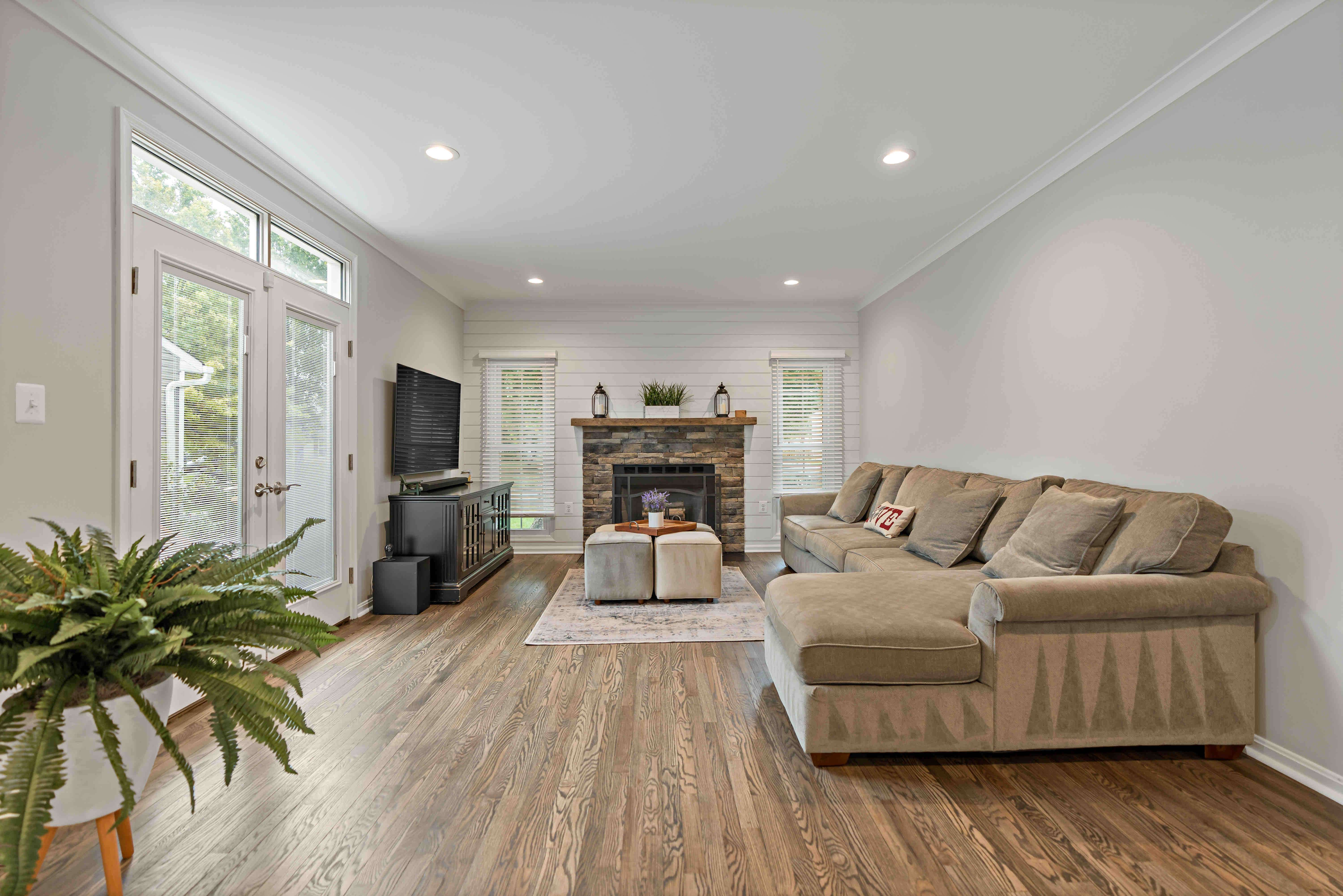 Living room with hard wood floors and stone fireplace