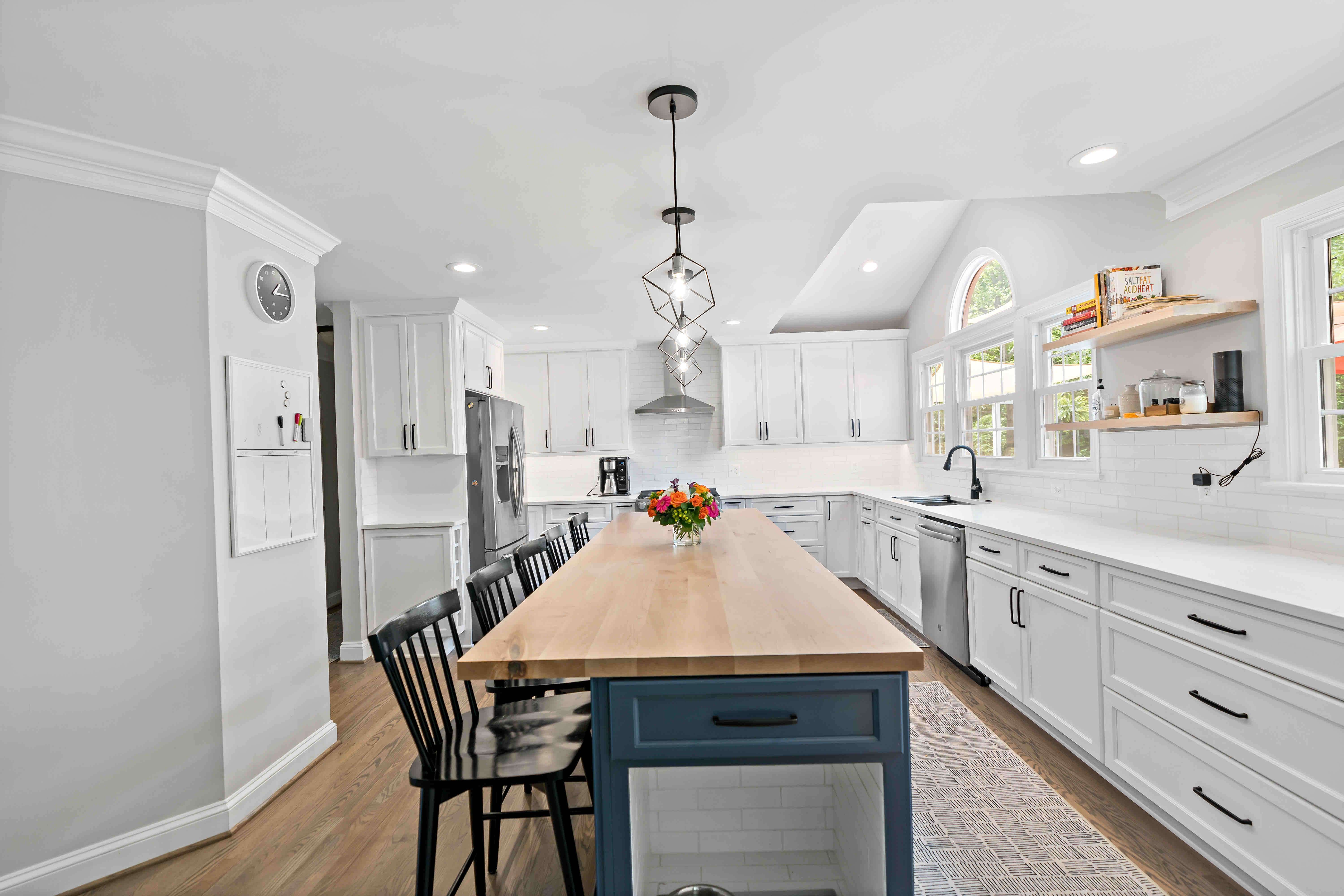 White kitchen with blue kitchen island