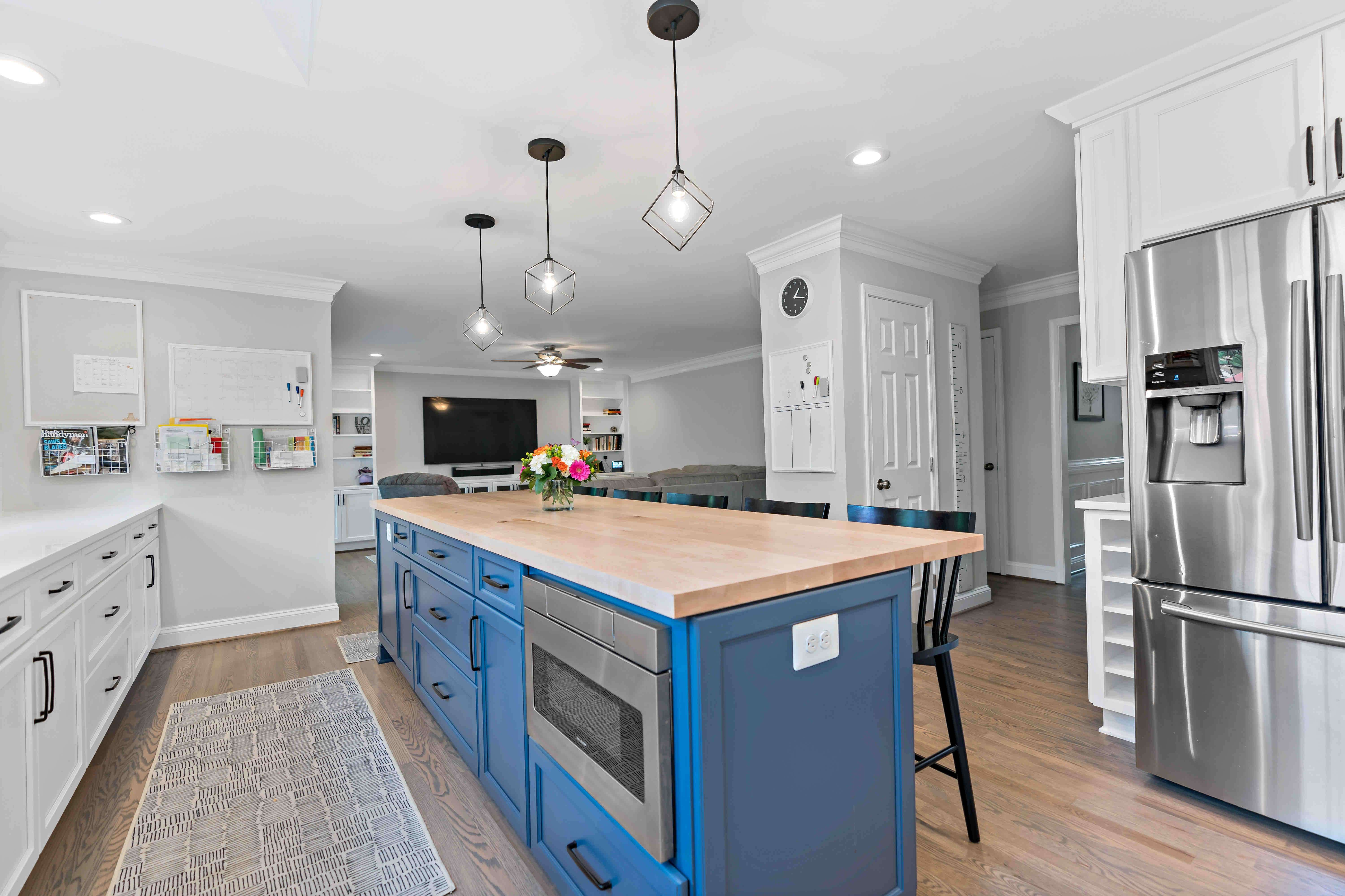 Spacious kitchen with long blue island