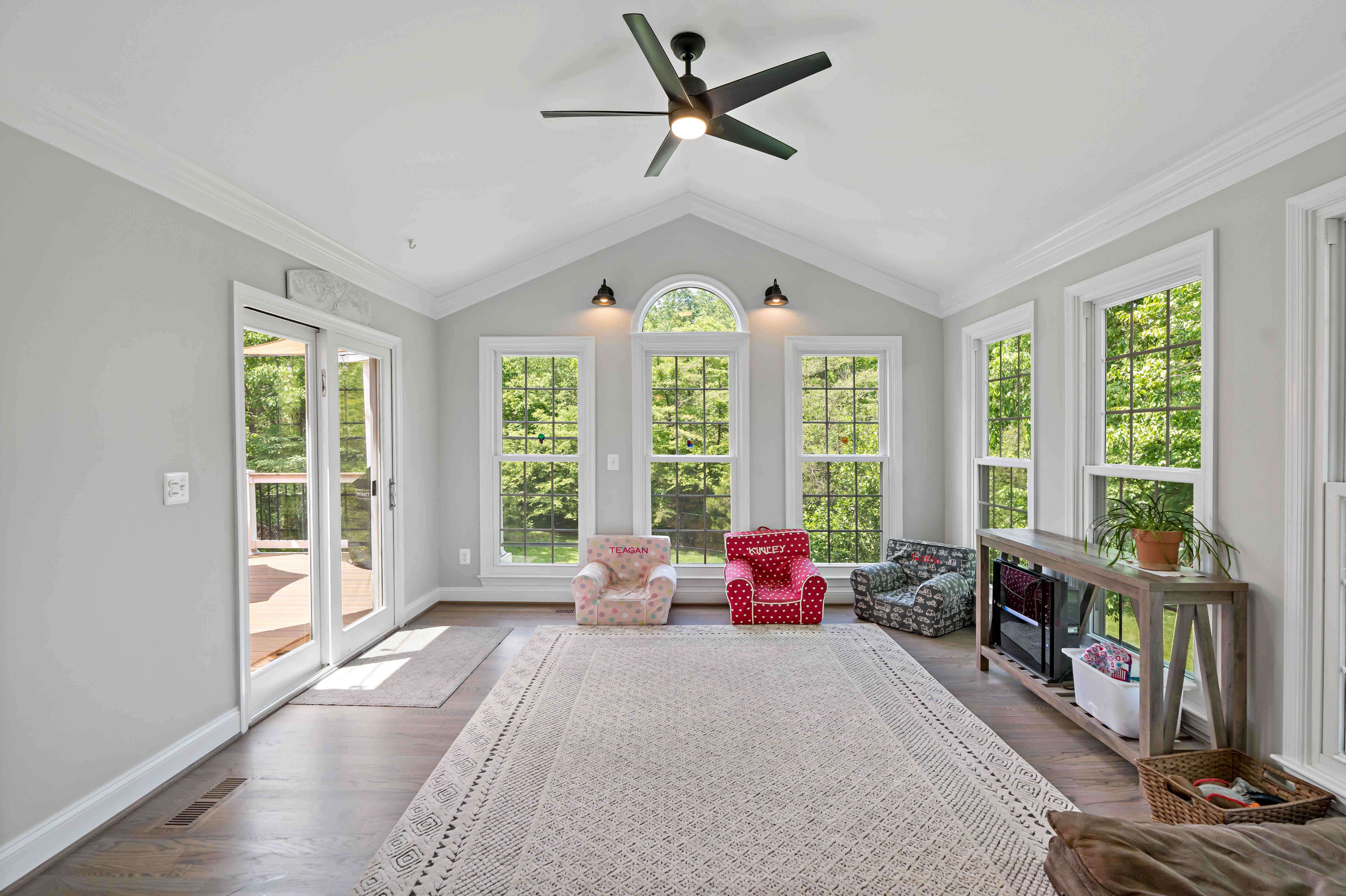 Open room with large windows and cathedral ceiling