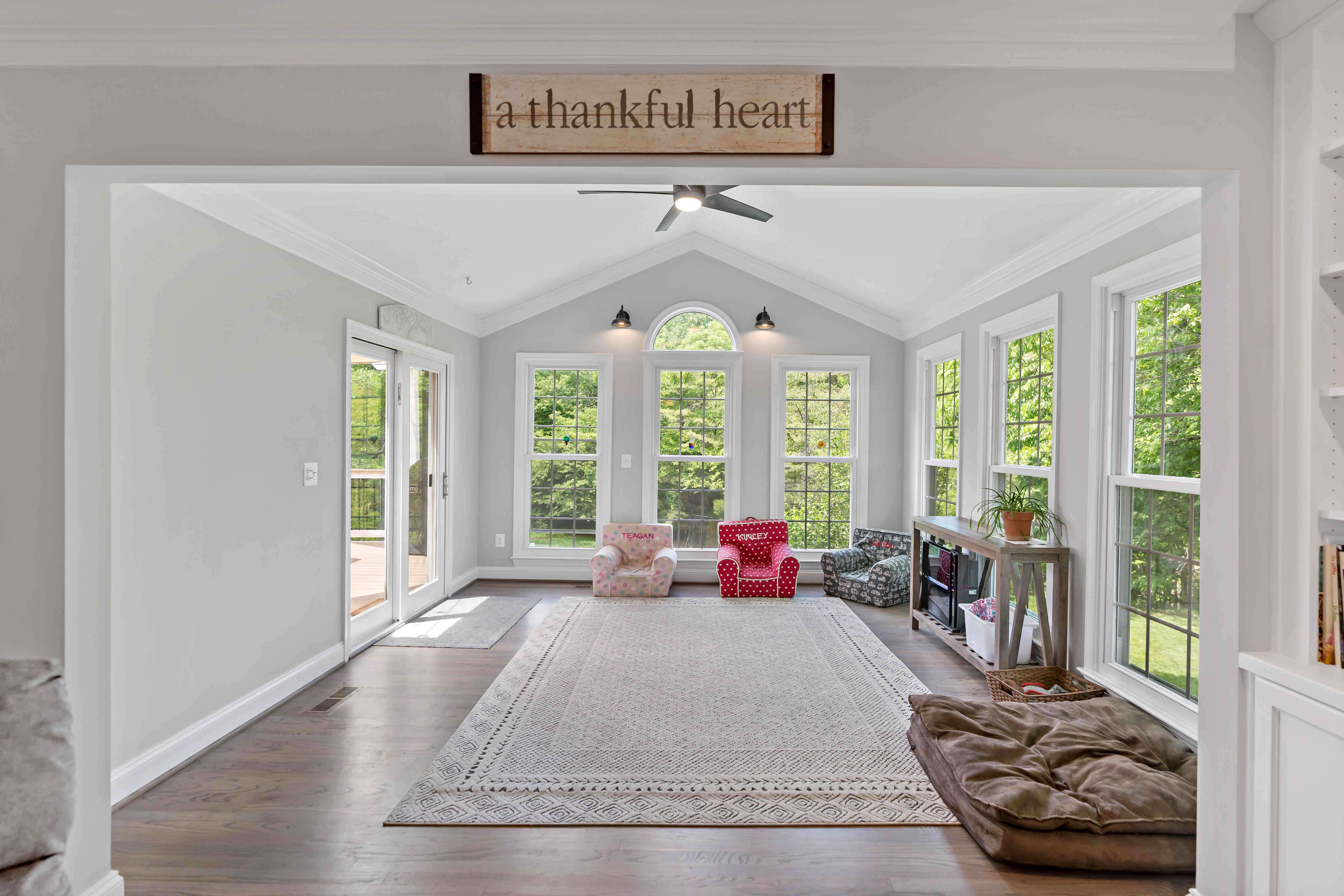 Open sunroom with hard wood floors