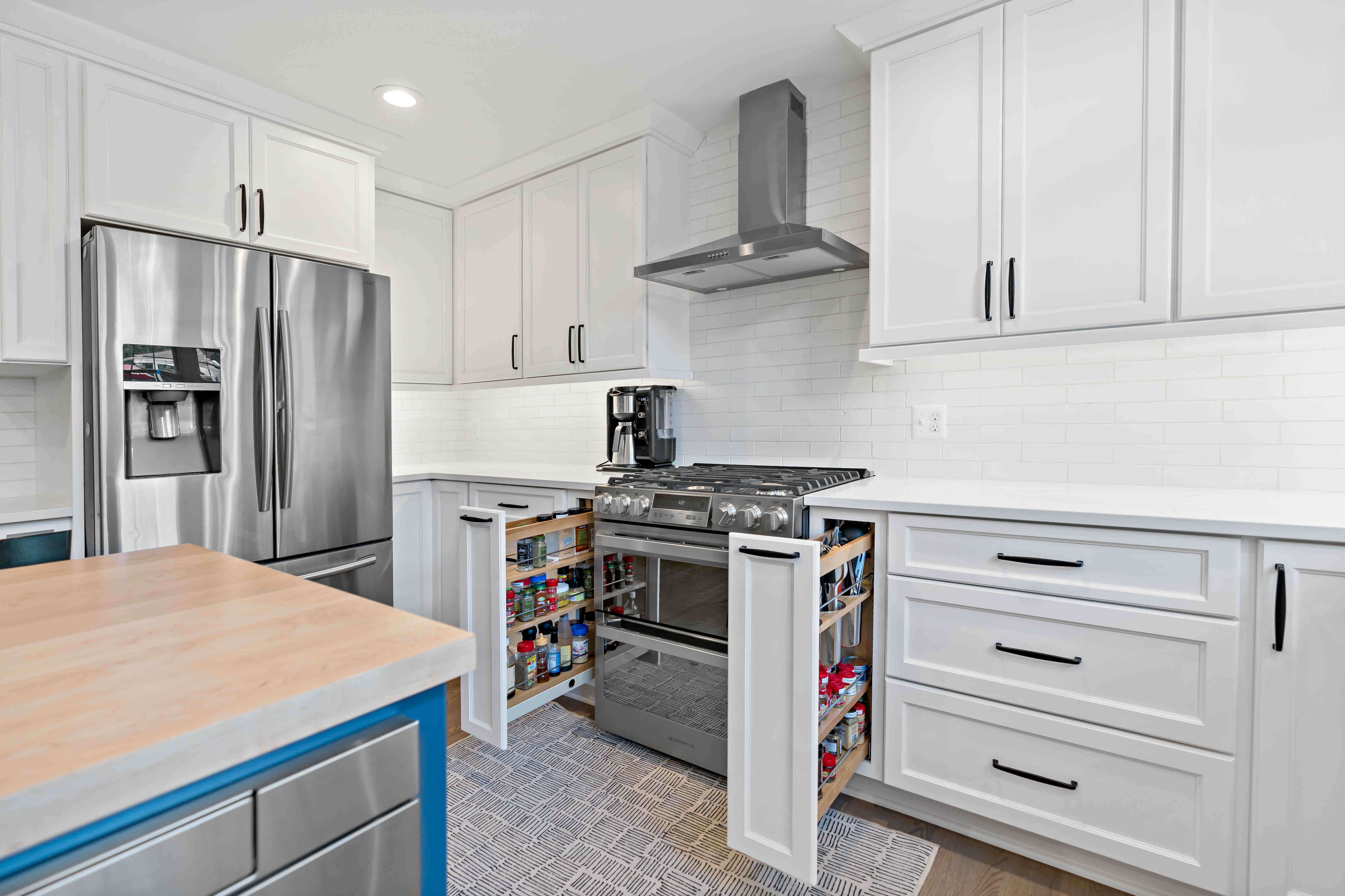 Pull out custom cabinetry drawers next to stove