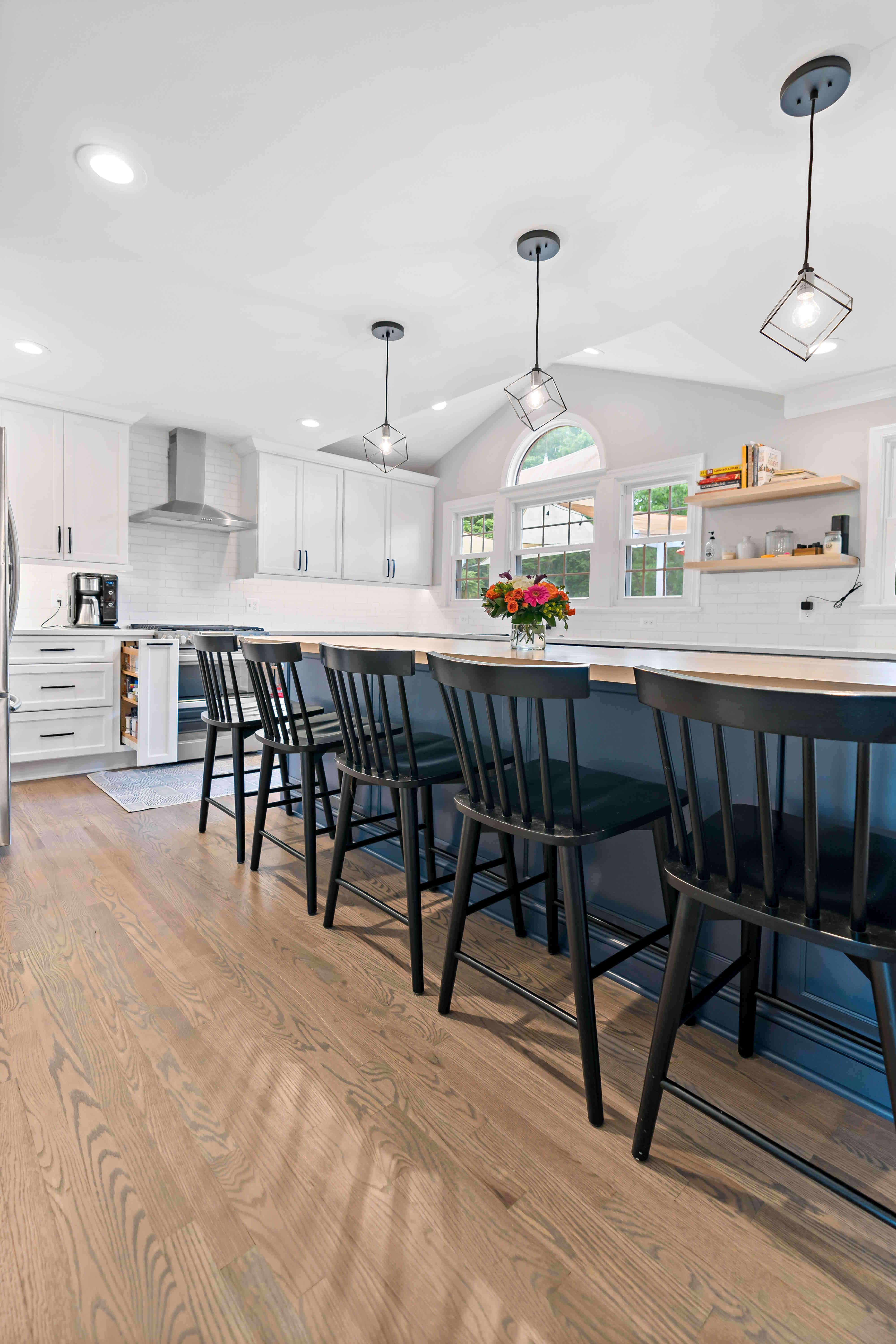 Hard wood flooring in white and blue kitchen
