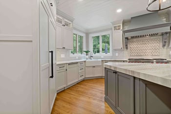 White cabinetry and hidden kitchen appliances