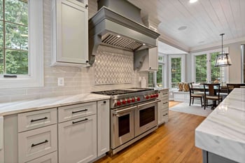 Gas stove and range with accent tile backsplash in farmhouse kitchen