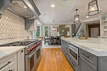 Gas stove and range across from kitchen island in kitchen design