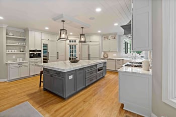 Farmhouse kitchen remodel with cabinetry to ceiling for storage