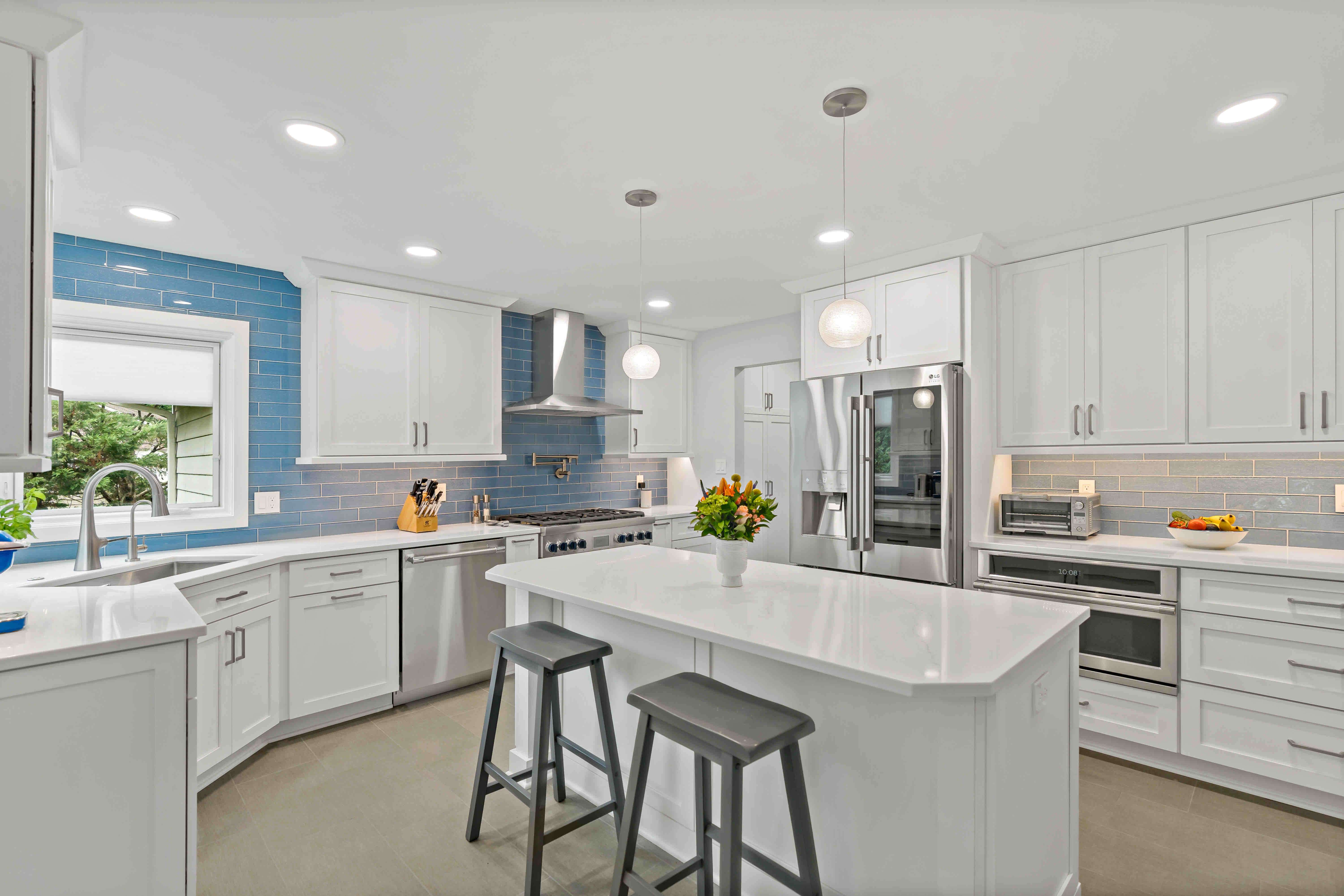 Rectangular kitchen island with blue backsplash