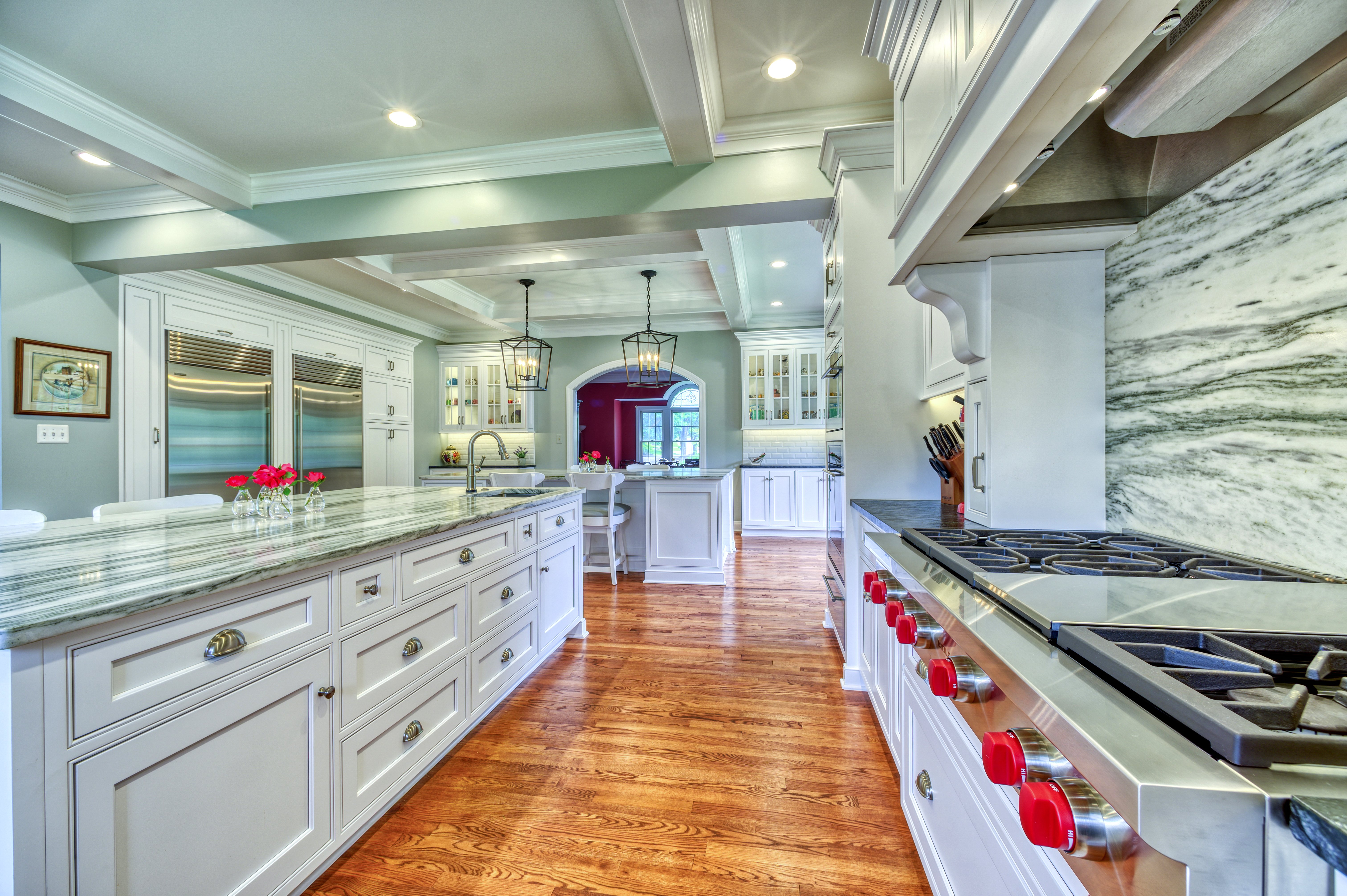 Marble backsplash behind gas stove in kitchen