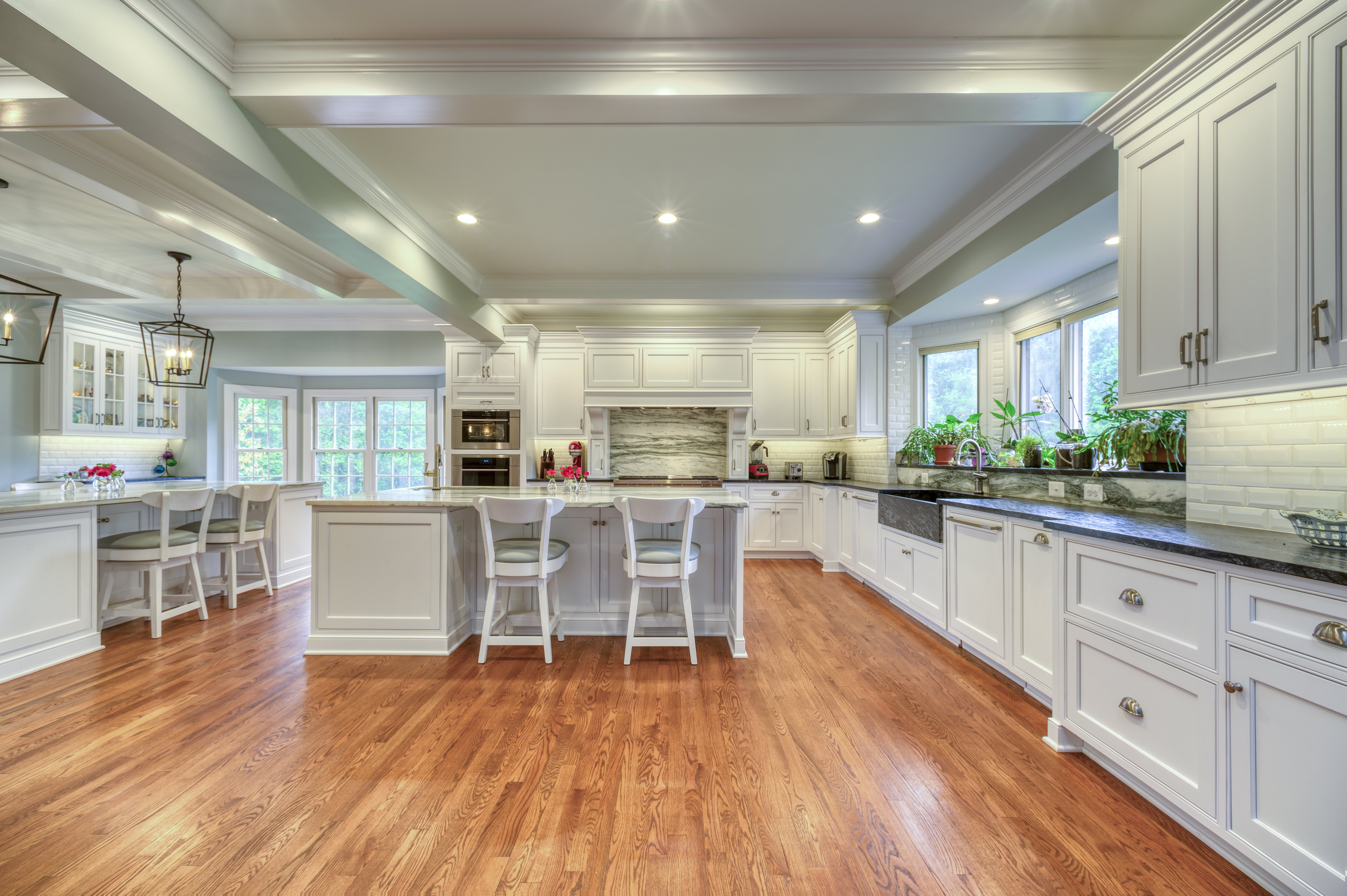 White cabinets and dark granite countertops in kitchen