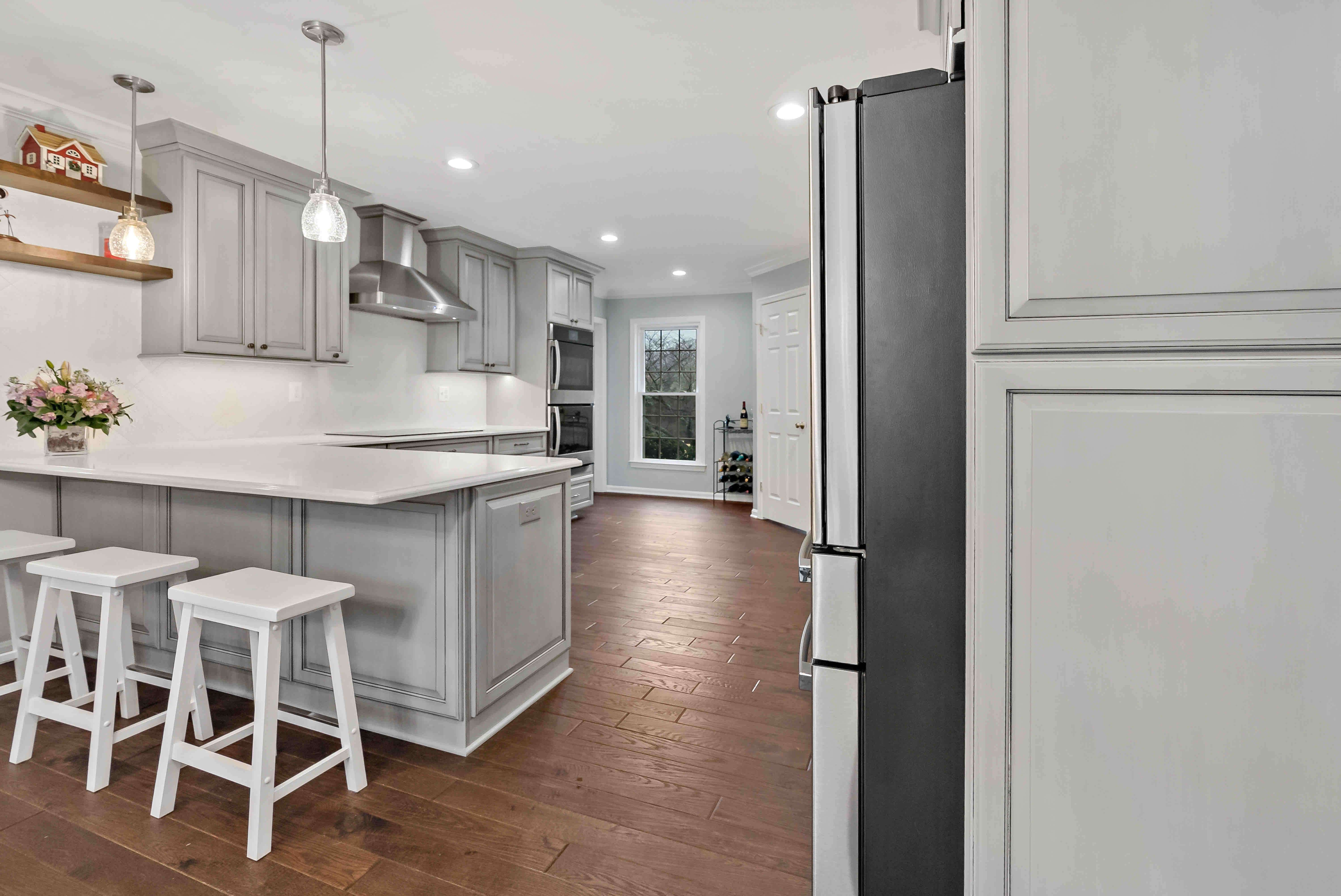 White bar stools in grey kitchen