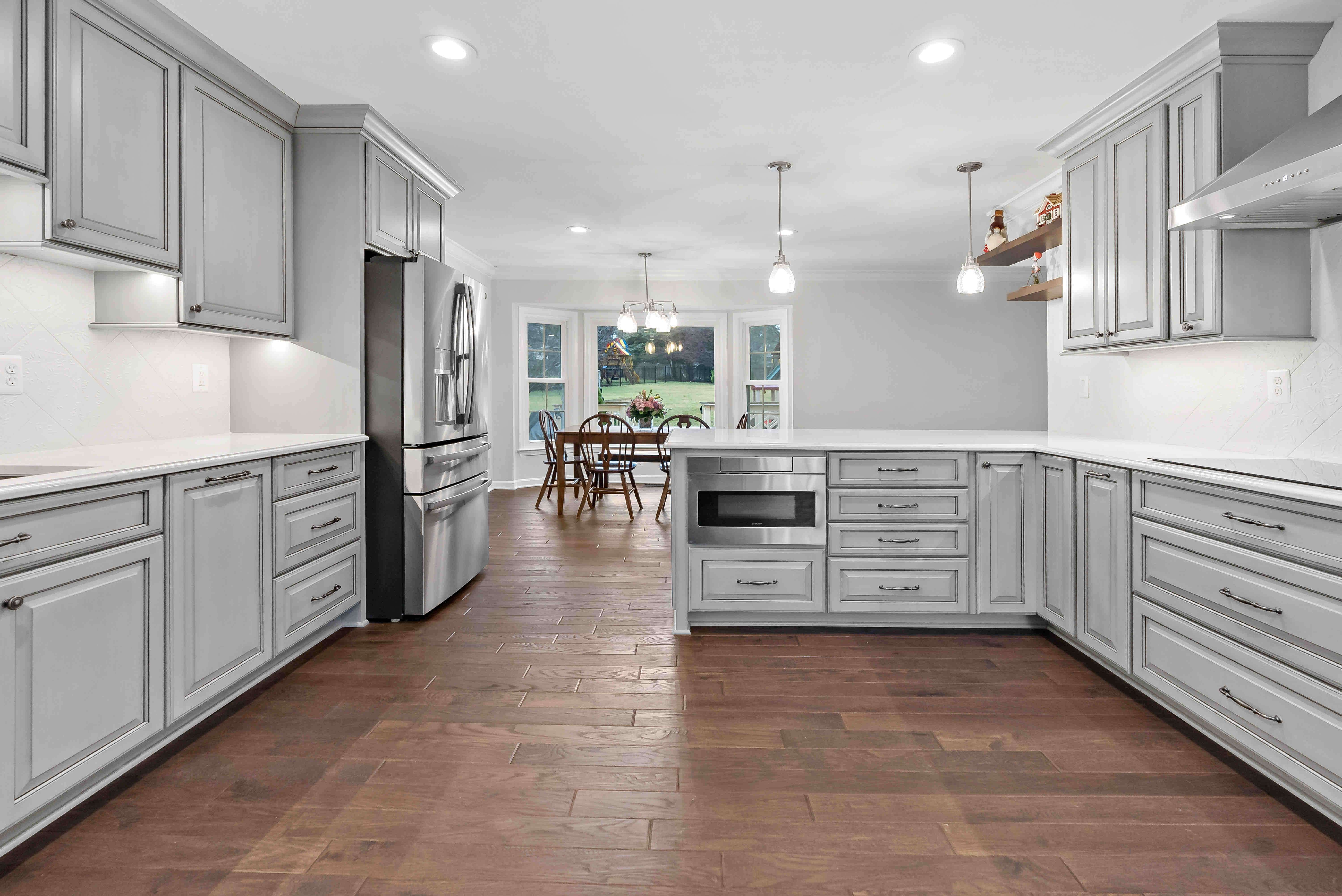 Open floor space in all grey kitchen