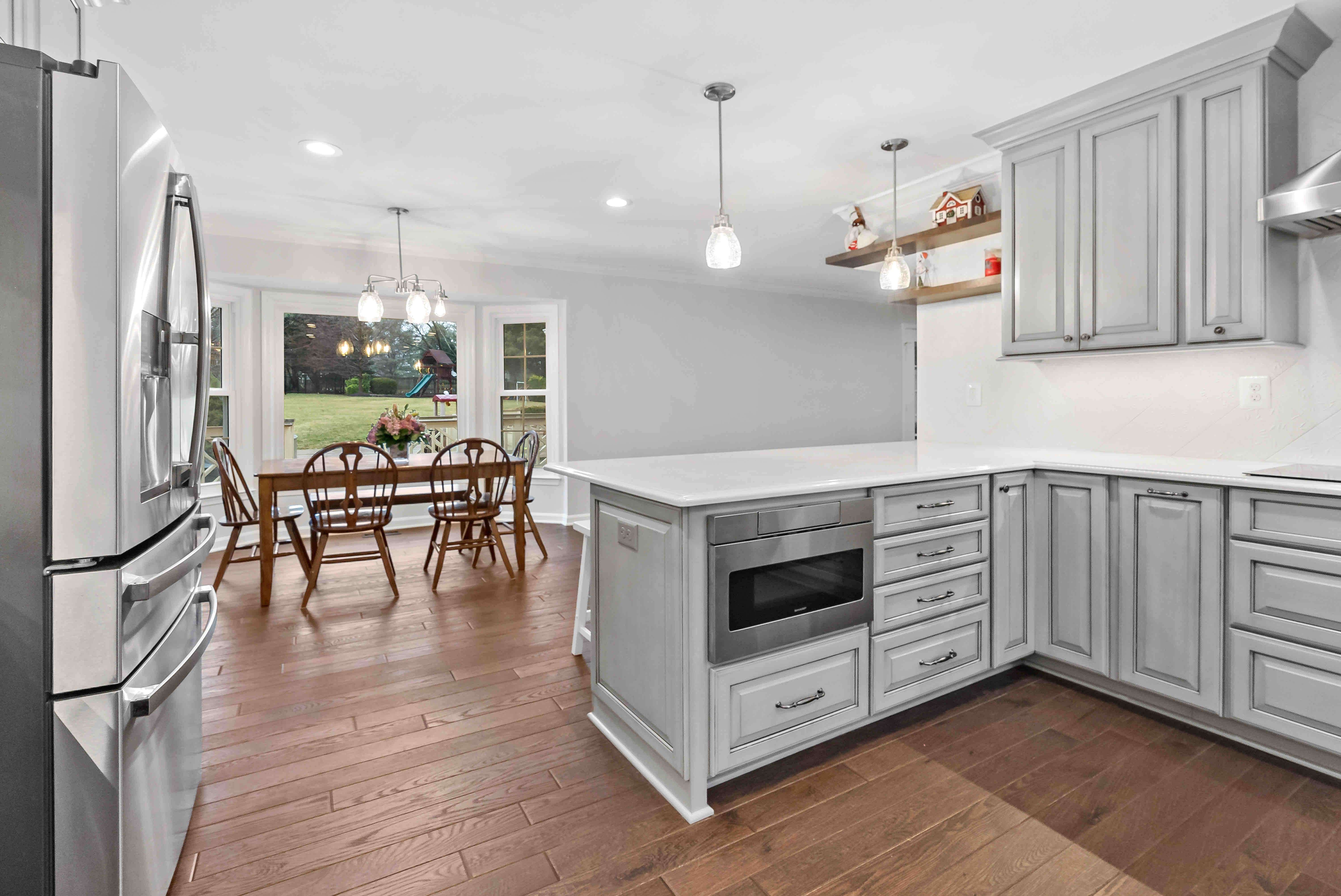 Pendant lighting above seating area in kitchen