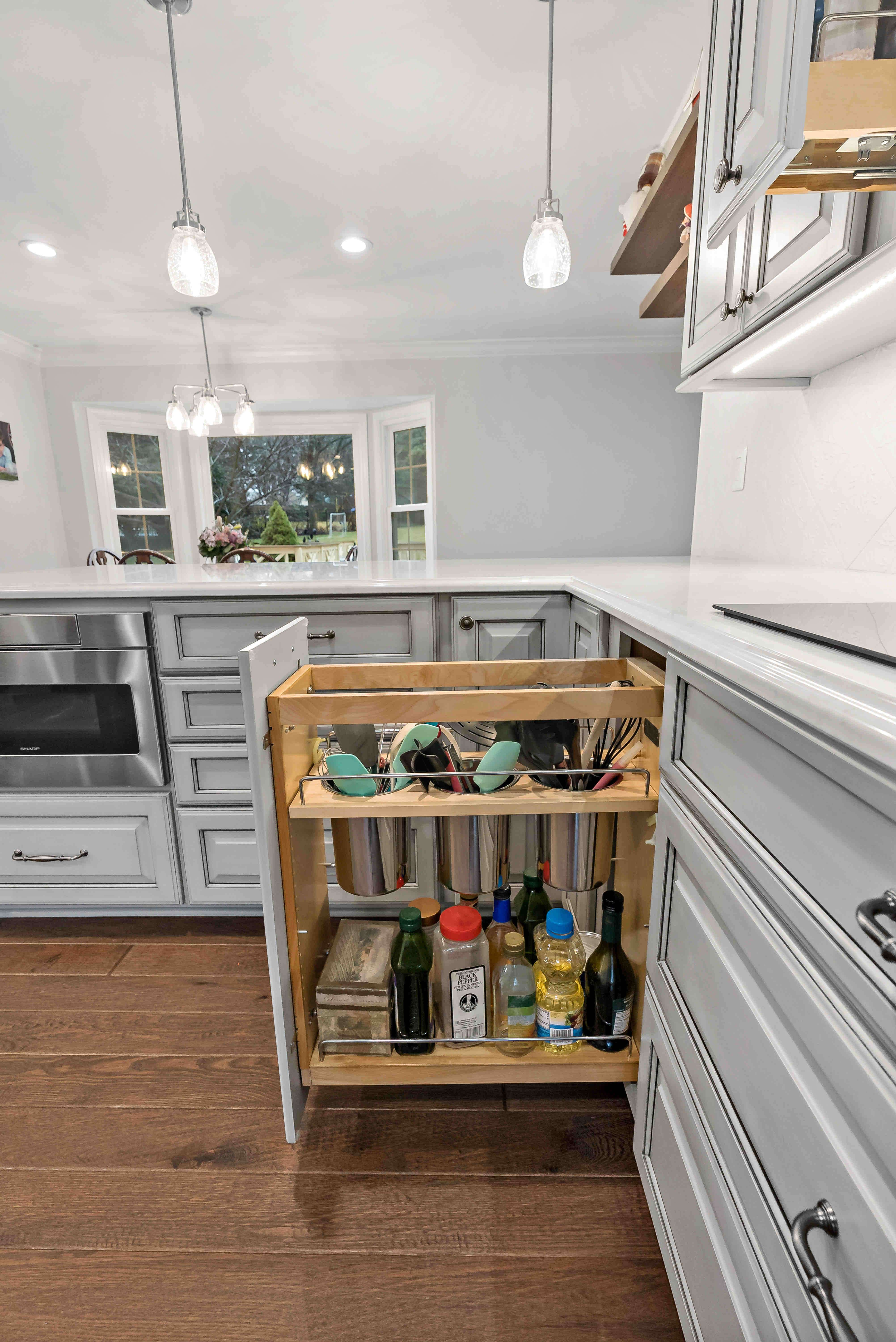 Custom cabinetry pull-out cupboards for kitchen organization