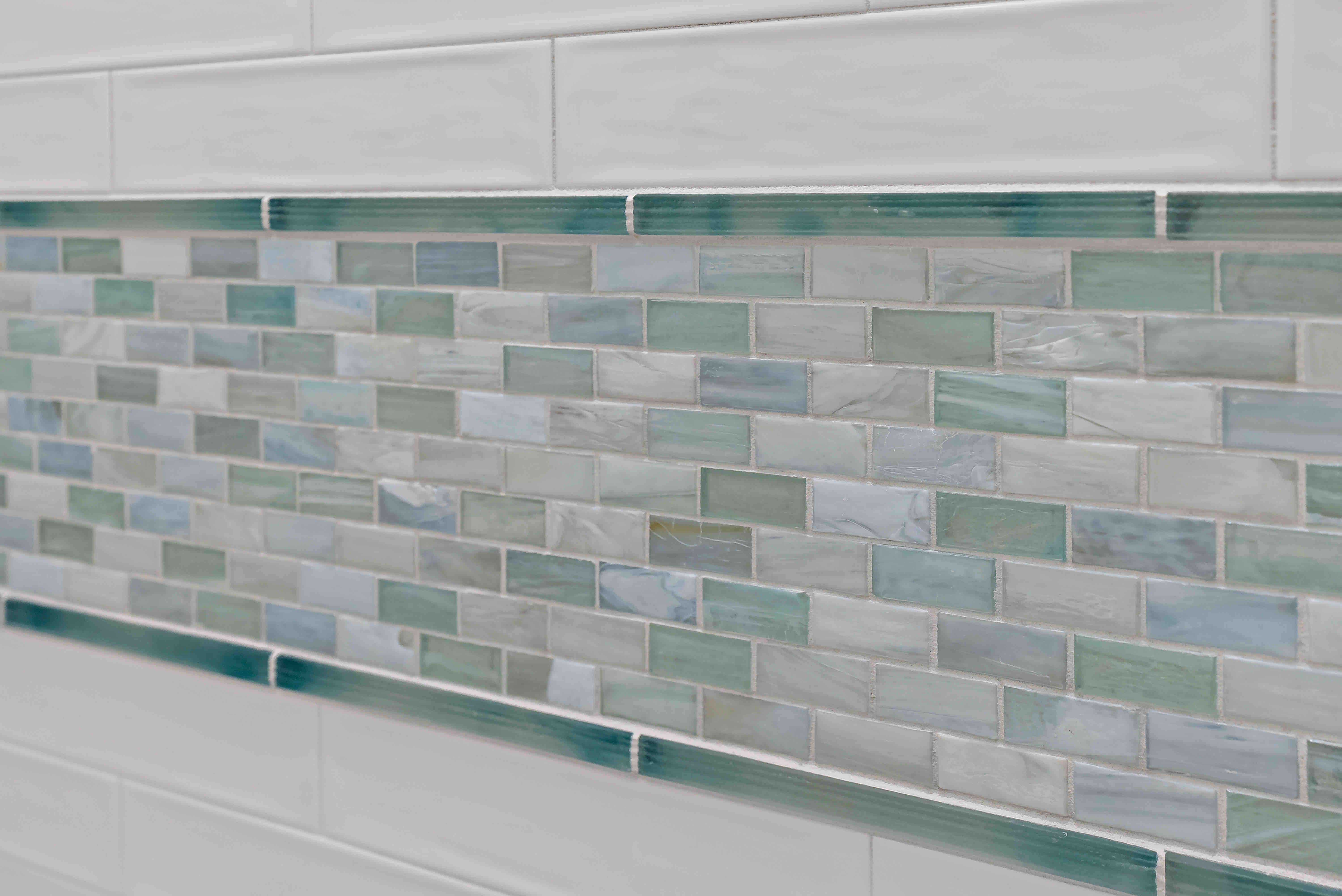 Blue green and white shower tiles 