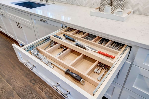 White kitchen with silverware drawer storage