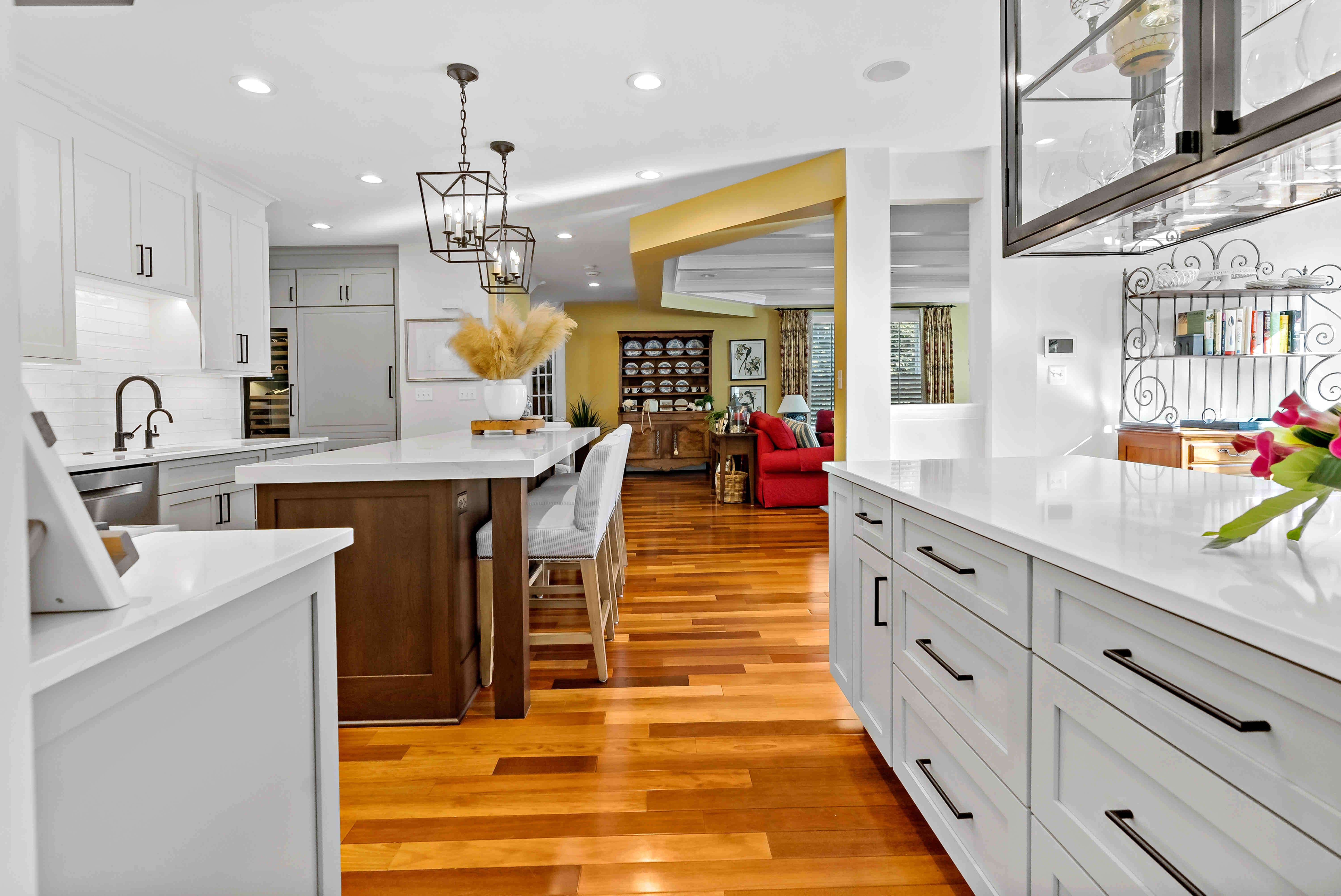 White cabinets with black handles in kitchen