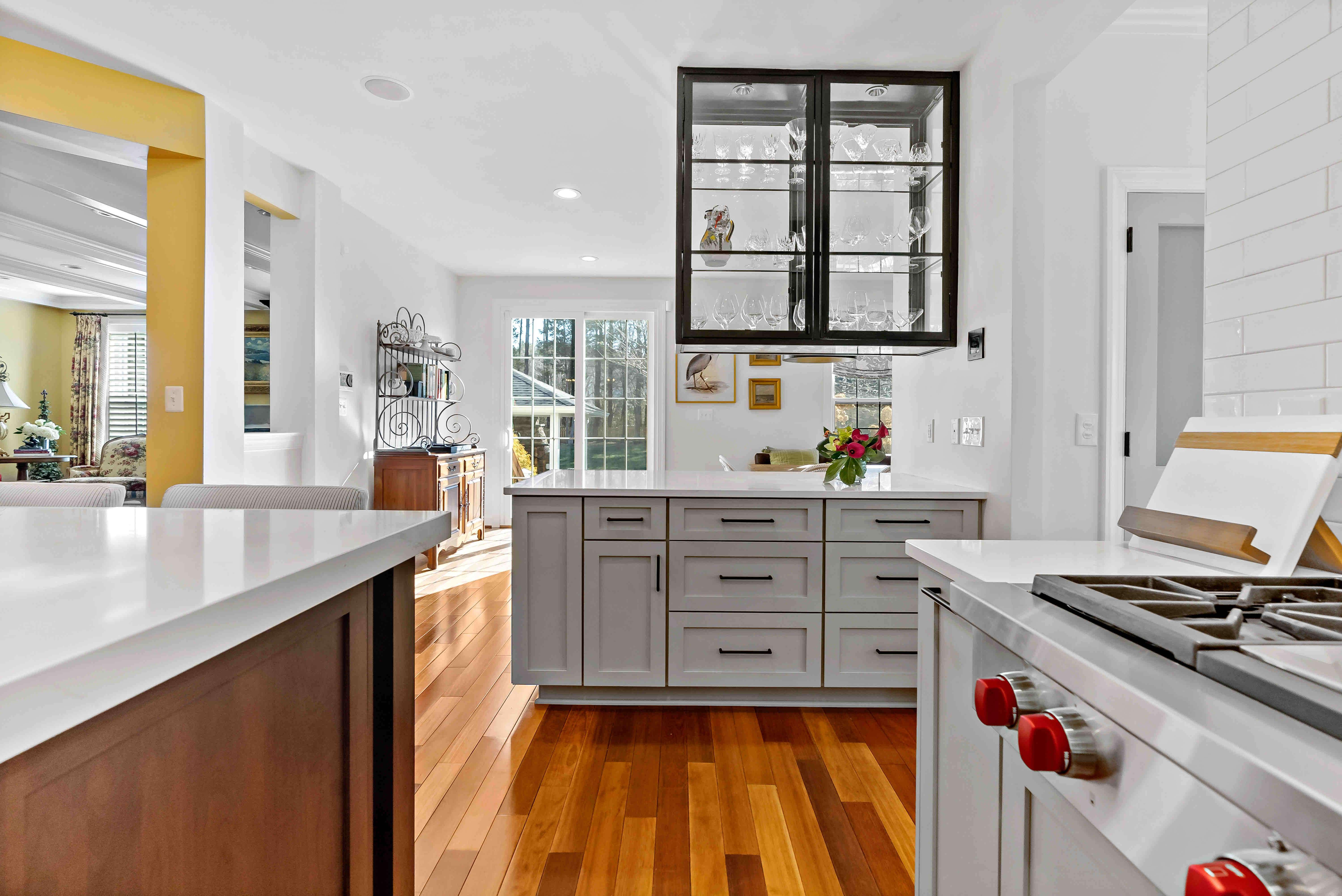 Hard wood flooring in white kitchen
