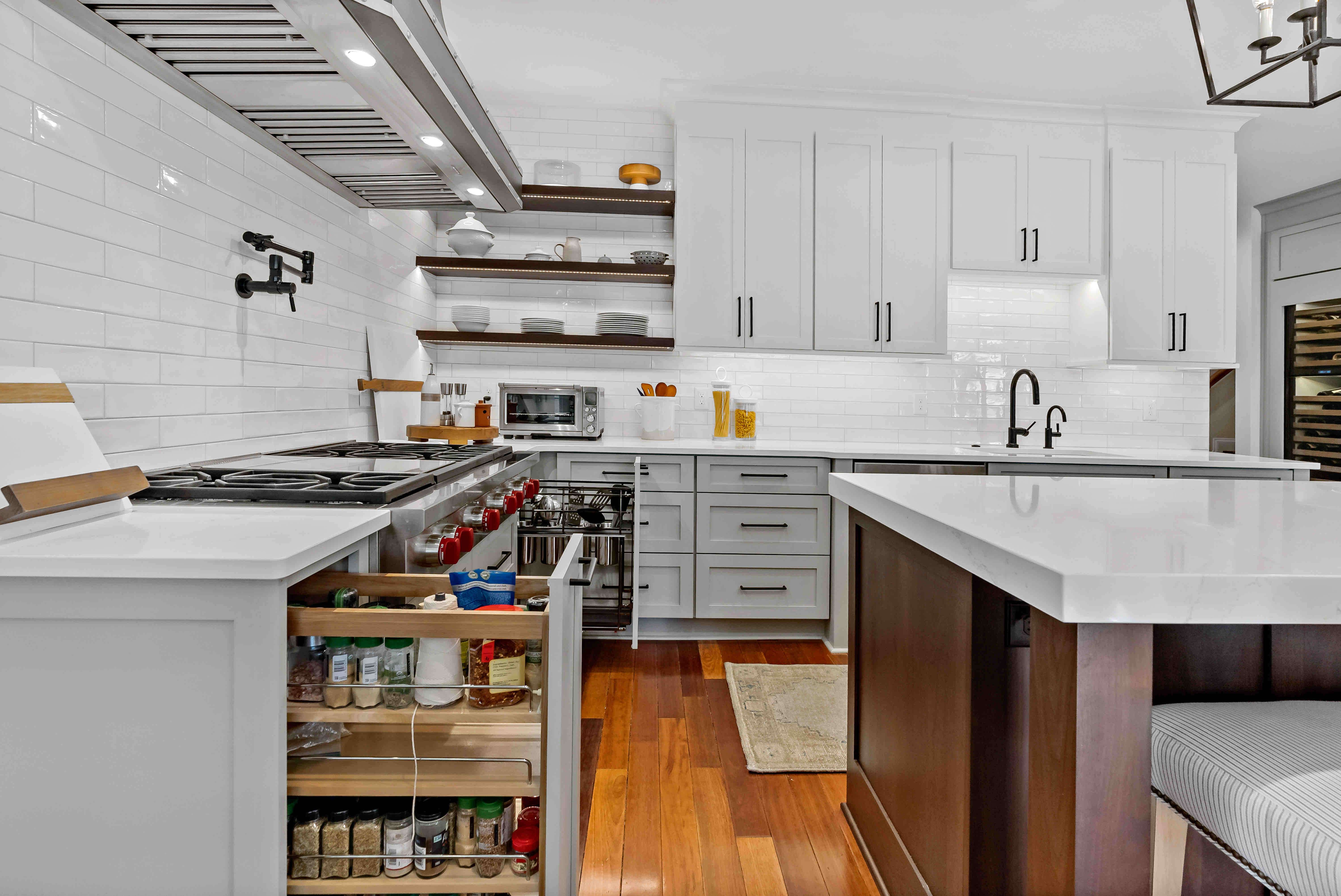 Custom cabinetry with pull out drawer for spices