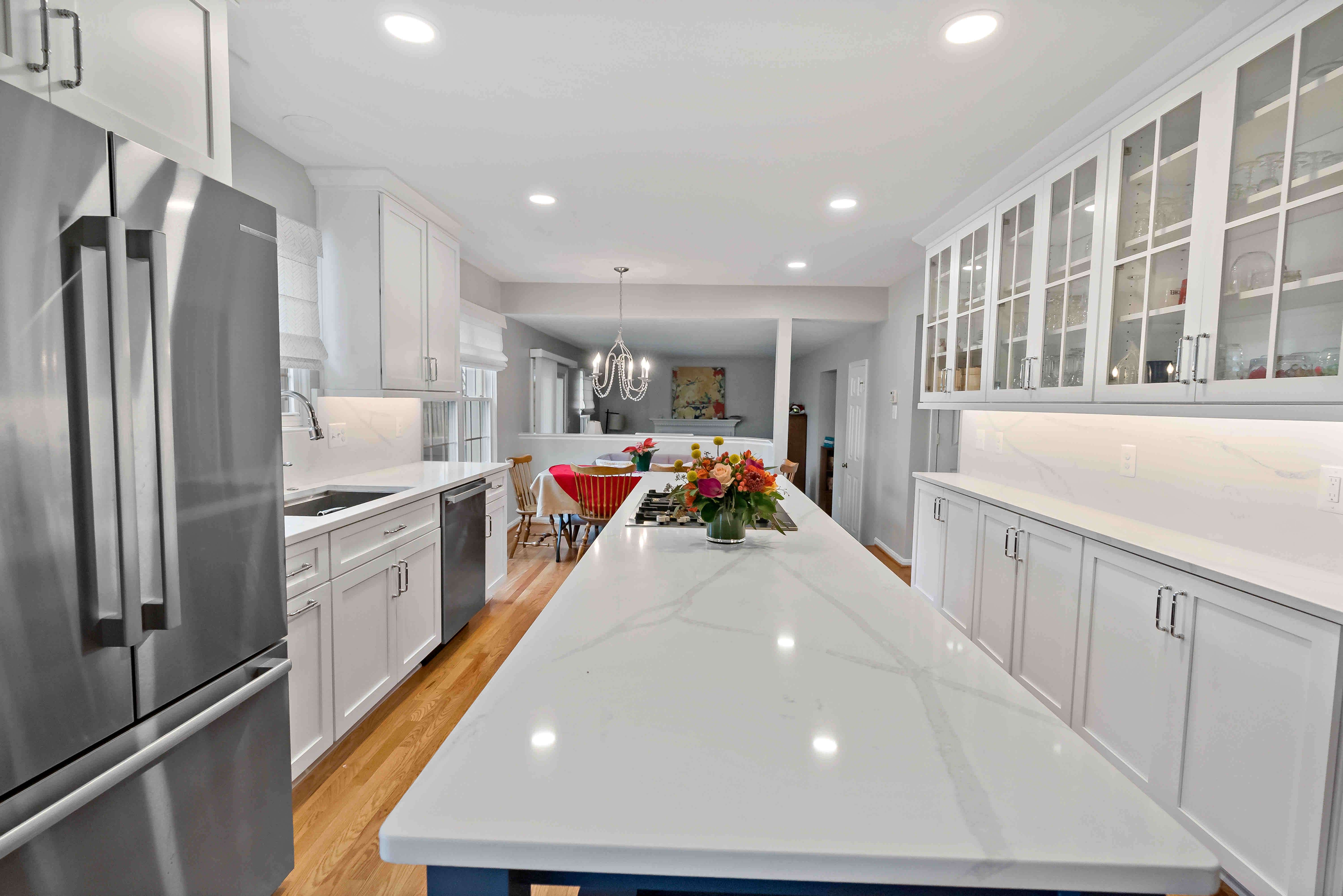 All white kitchen with glass see-through cabinets