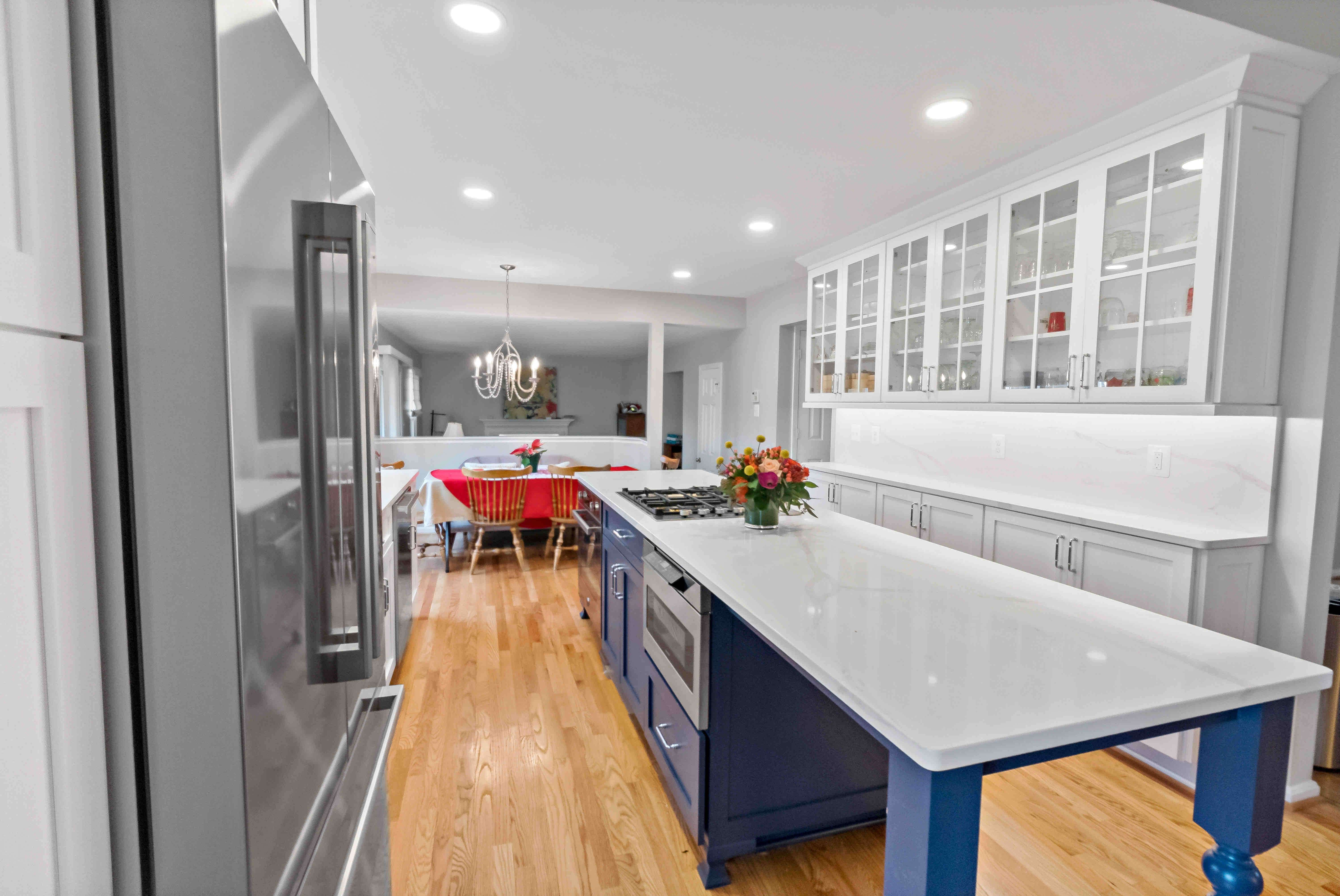 White countertop on blue kitchen island