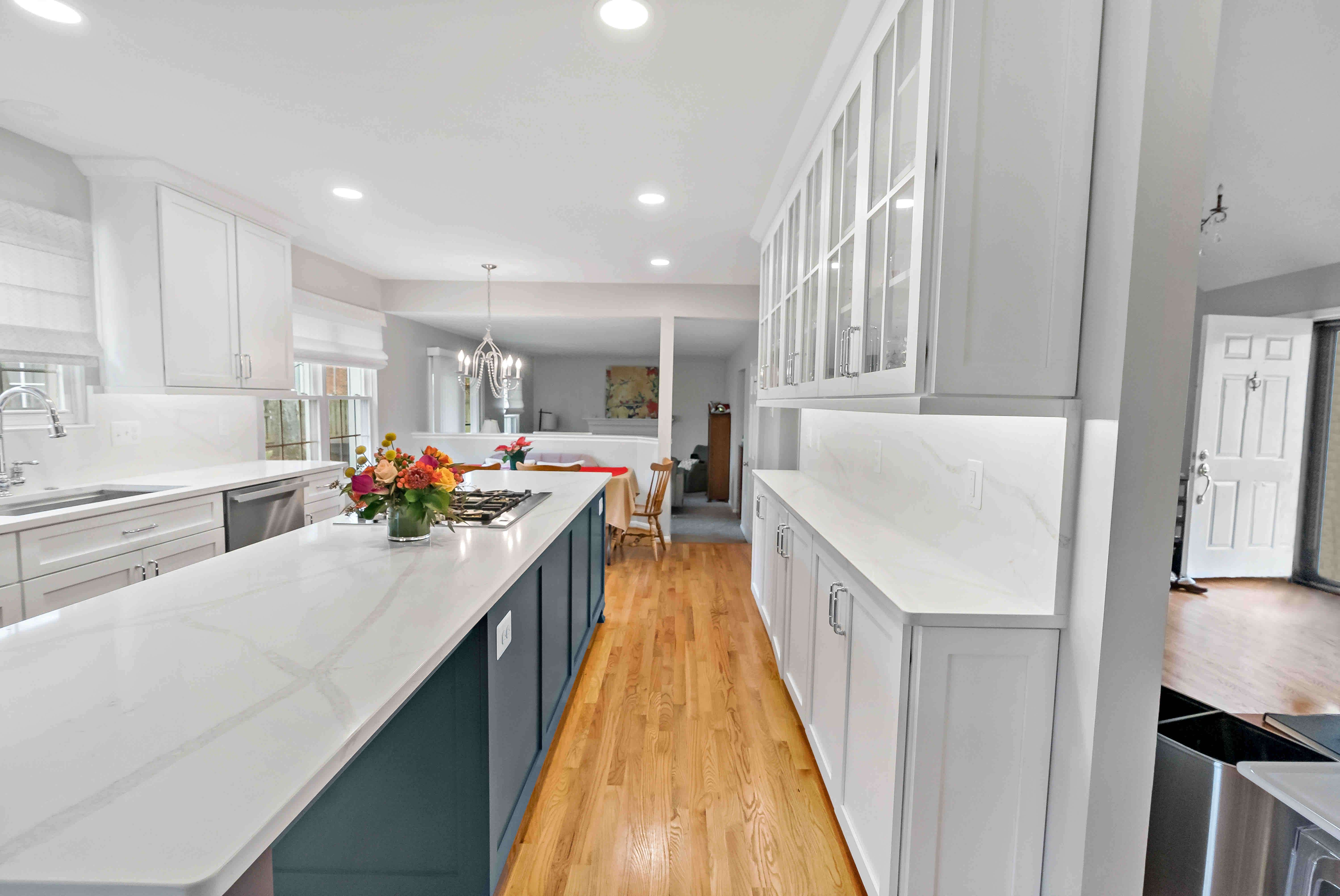 Large kitchen island in white kitchen