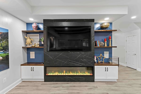 built in entertainment center with shelves and electric fireplace