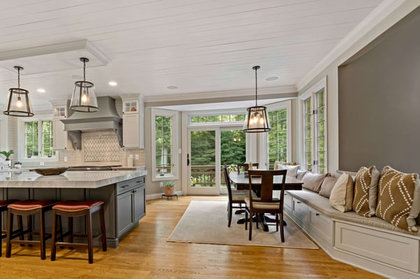 Open concept kitchen with kitchen table and bench for seating