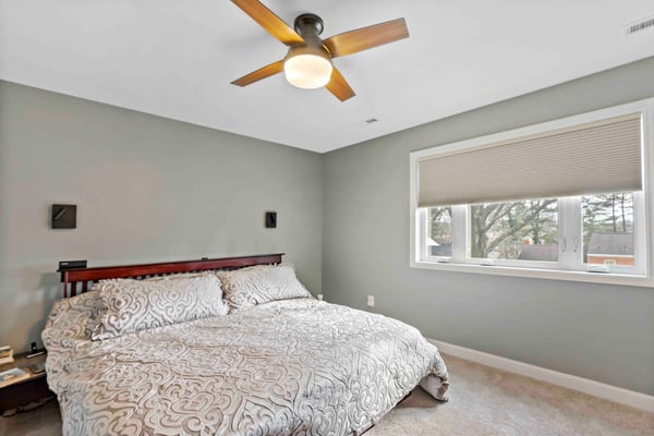 Carpeted bedroom with king size bed