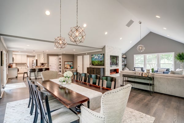 Dining table with runner and open concept kitchen living room area