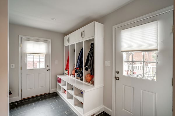 White mudroom remodel with four individual sections