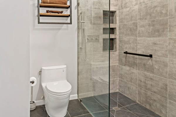 Modern design full bathroom with walk-in shower and taupe tile