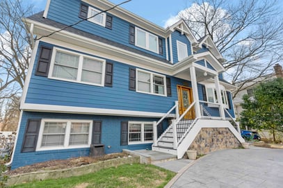 Staircase in front of blue house to enter