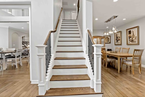 White and brown staircase in foyer