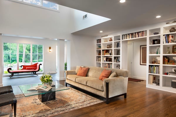 Windswept Living Room with large skylight and built-in bookshelf