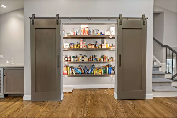 Brown, rustic, and modern sliding barn door for pantry in kitchen