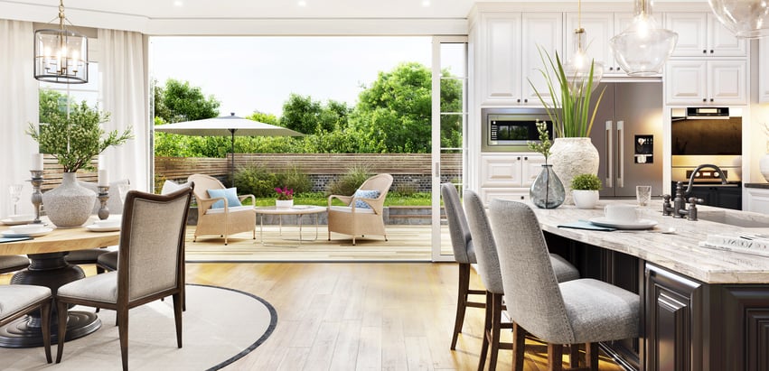 Open plan kitchen and dining area with patio