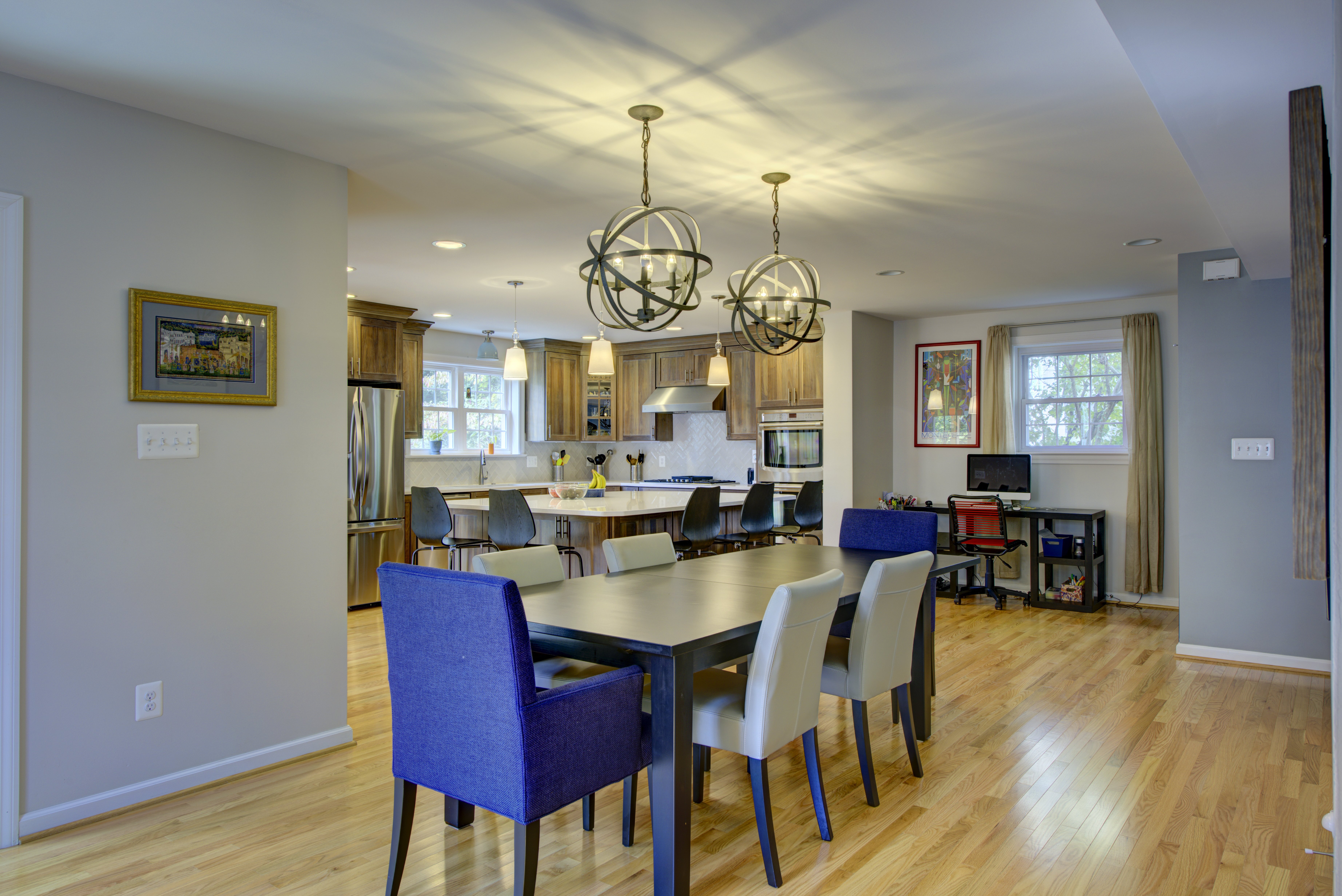 Dining room table with round pendant lighting