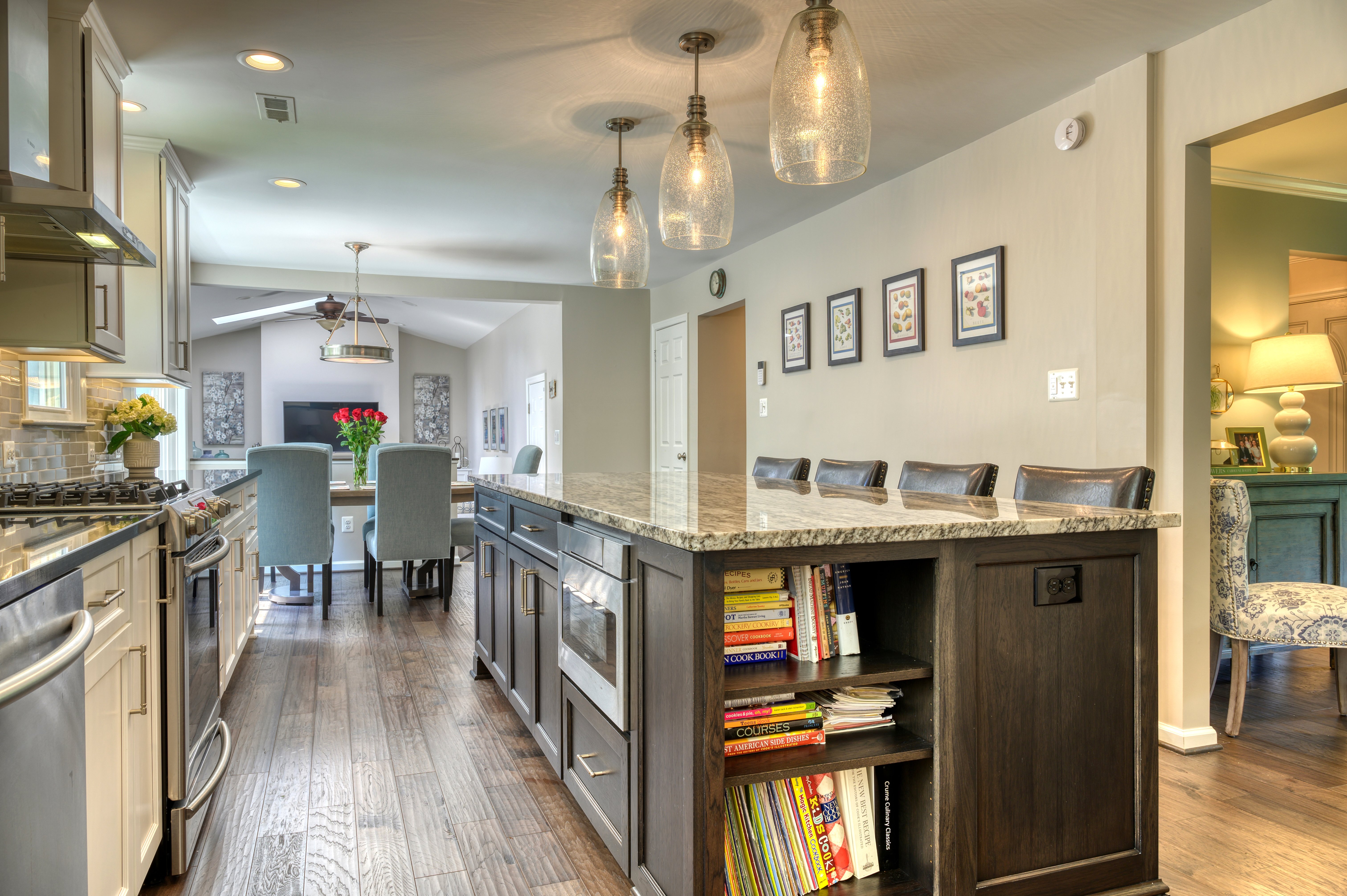 Dark brown kitchen island with open bookshelves built-in