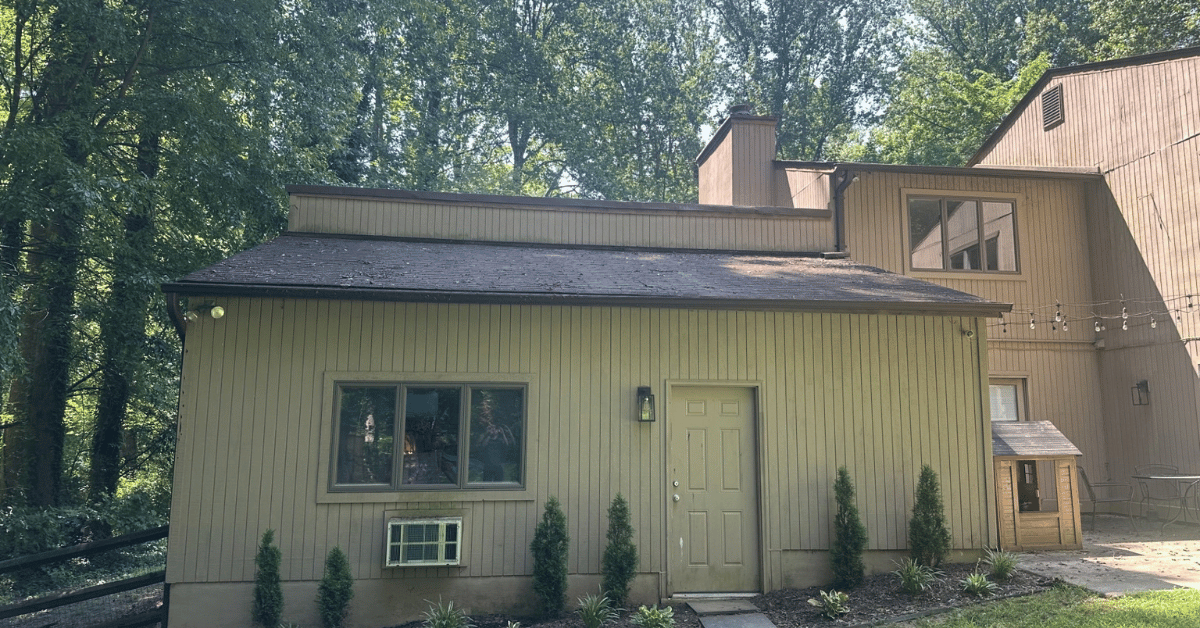 Before: back of house, location for addition above garage