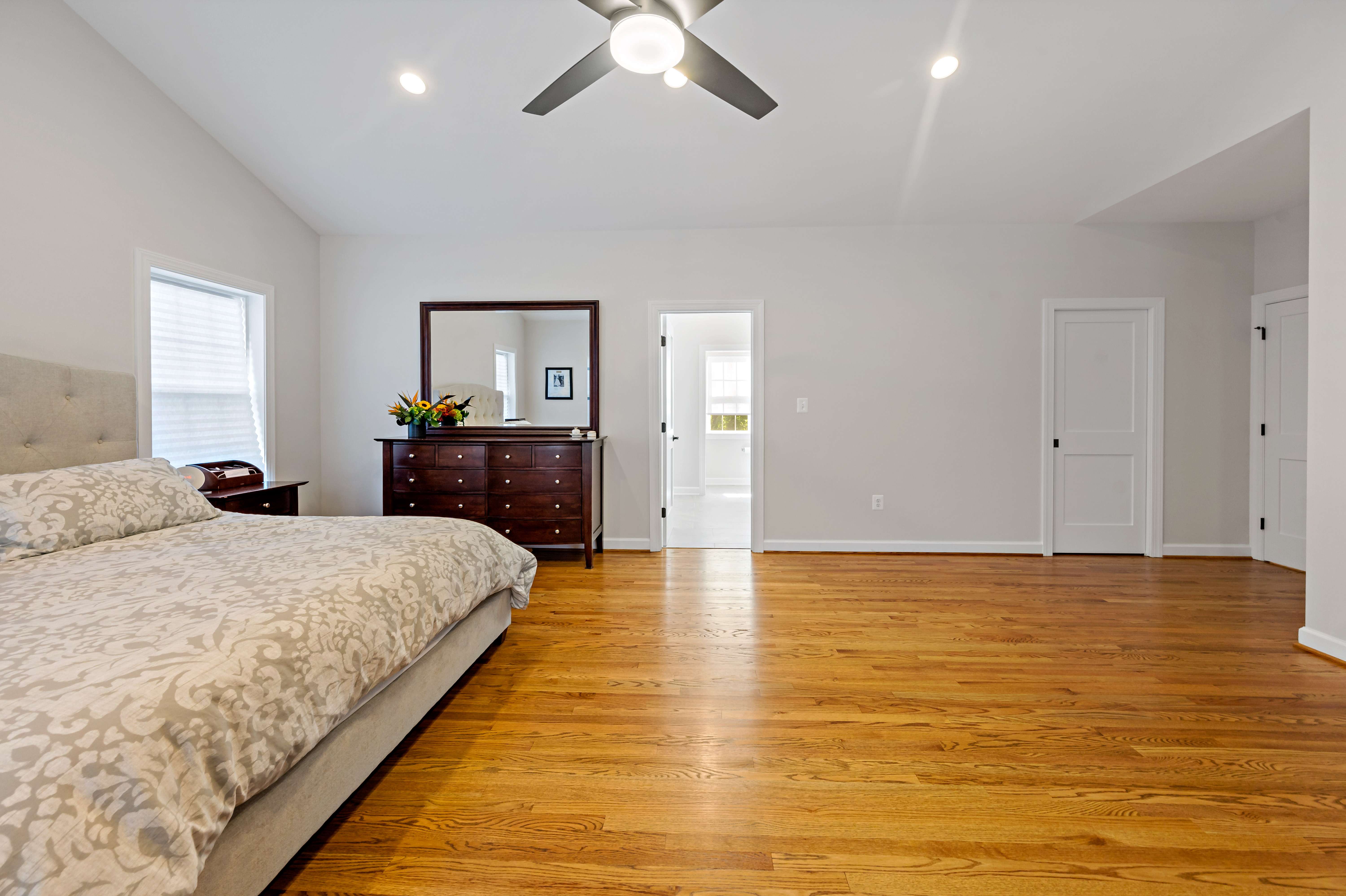 Light wood floors in spacious bedroom in McLean Light wood floors in spacious bedroom in McLean
