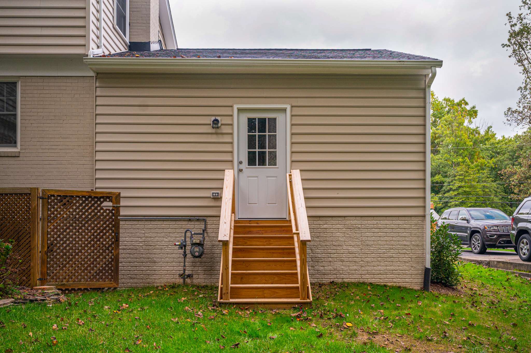 Staircase leading up to back door on home