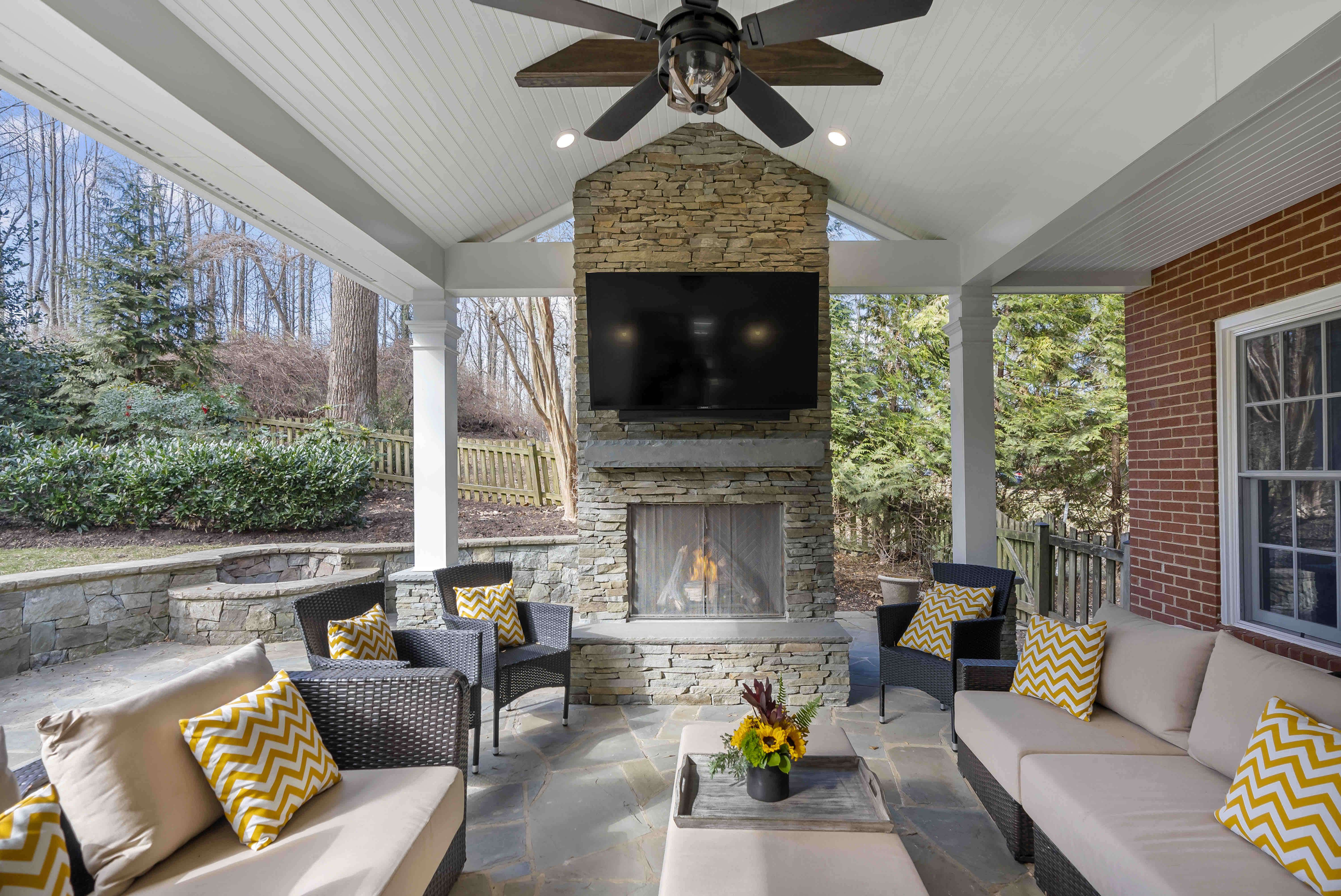 Beautiful New Outdoor Patio Space Features Stone Fireplace 