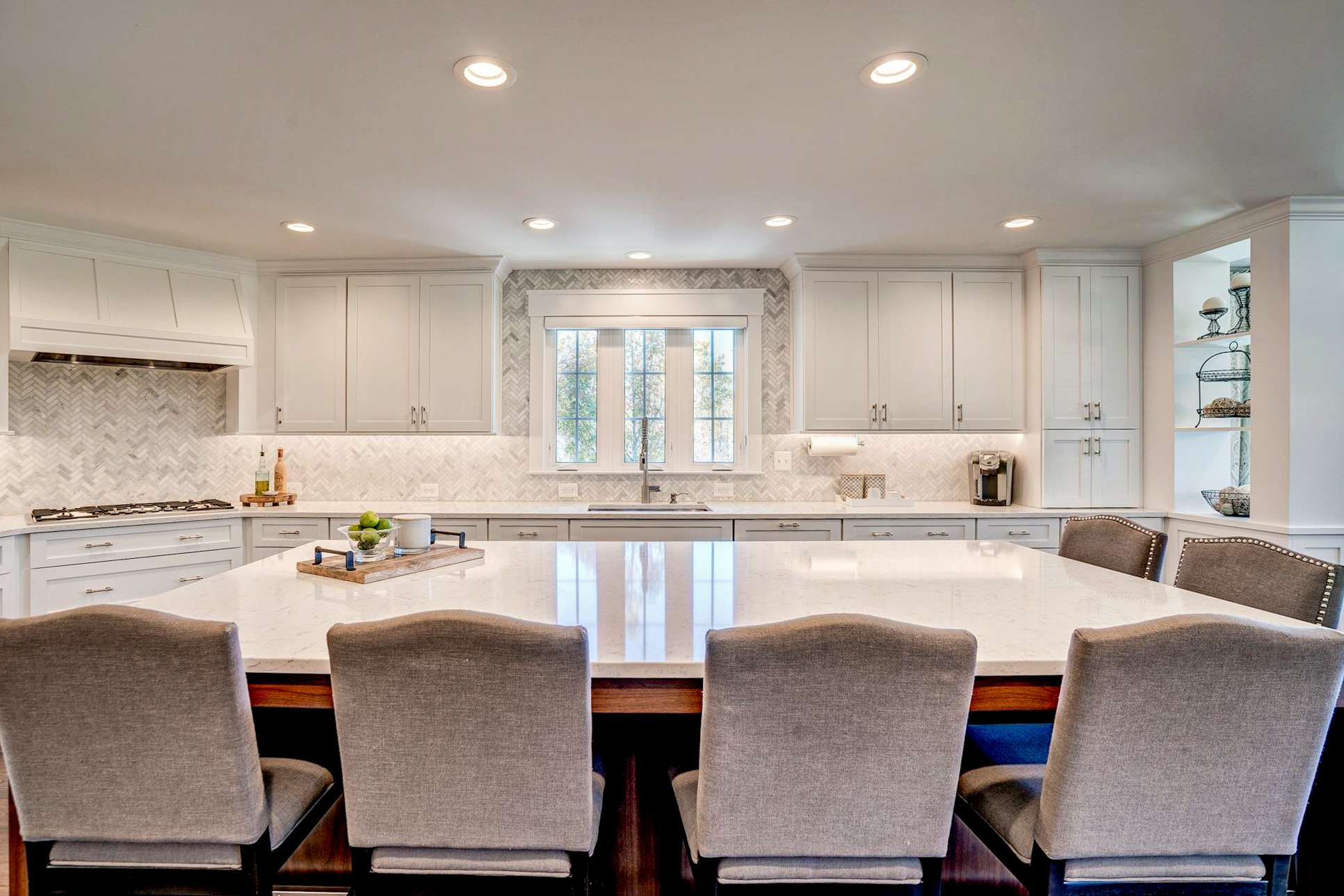 White kitchen with island and seating