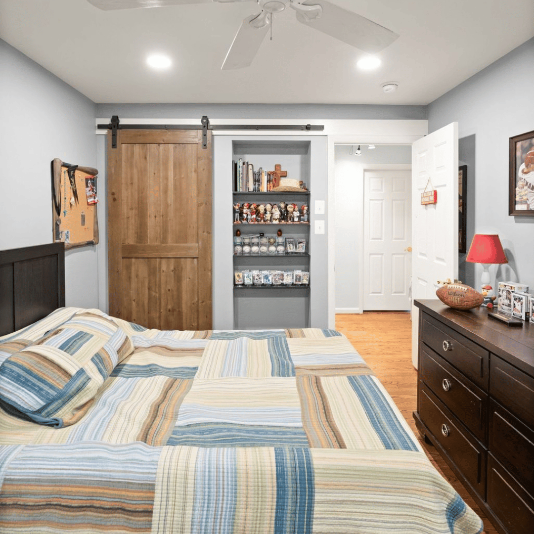 Sliding barn door conceals closet while allowing items to be displayed